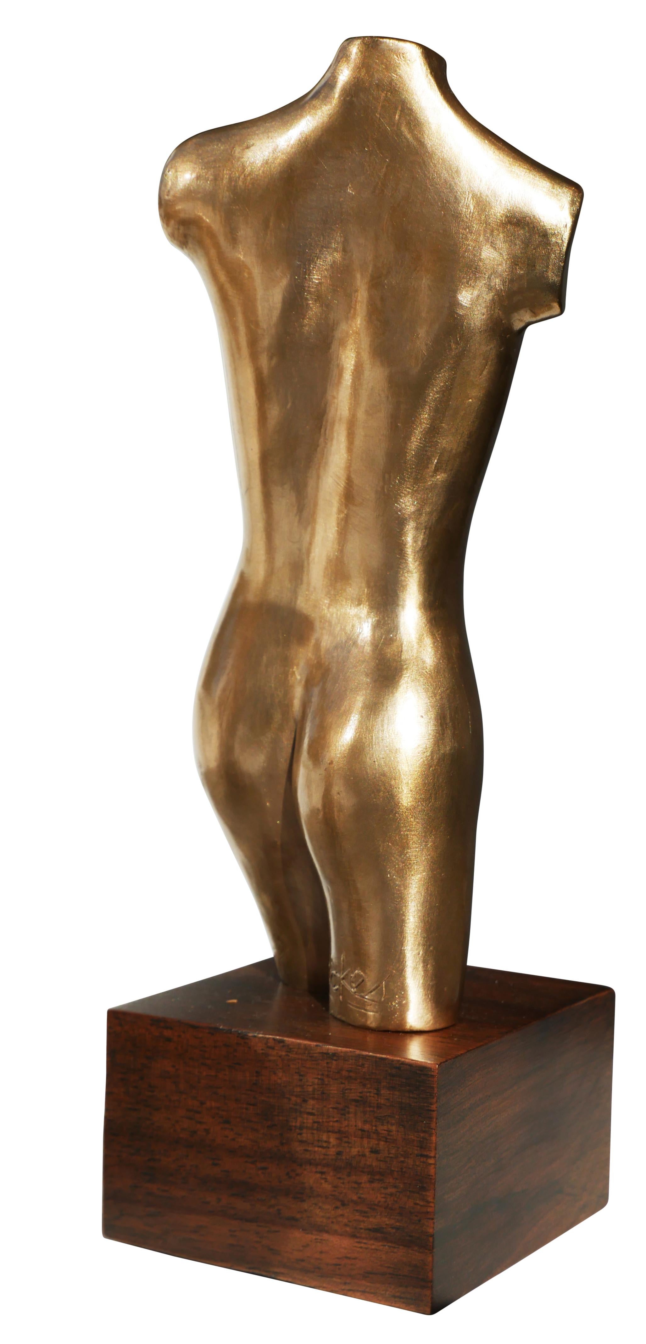 Modernist nude bronze sculpture by Houston, TX artist David Adickes. The sculpture depicts an abstract armless female nude torse that stands on a wooden base. The piece is signed by the artist at the back of the sculpture's left leg. 

Artist