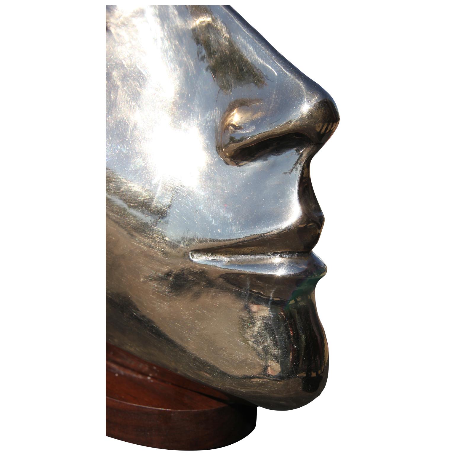 Modern abstract bronze portrait bust sculpture by Houston, Texas artist David Adickes. The work is modeled after Adickes' friend, Julie Burrows, and features sharp facial features and mounted on a wooden base. Signed by artist on the back of the