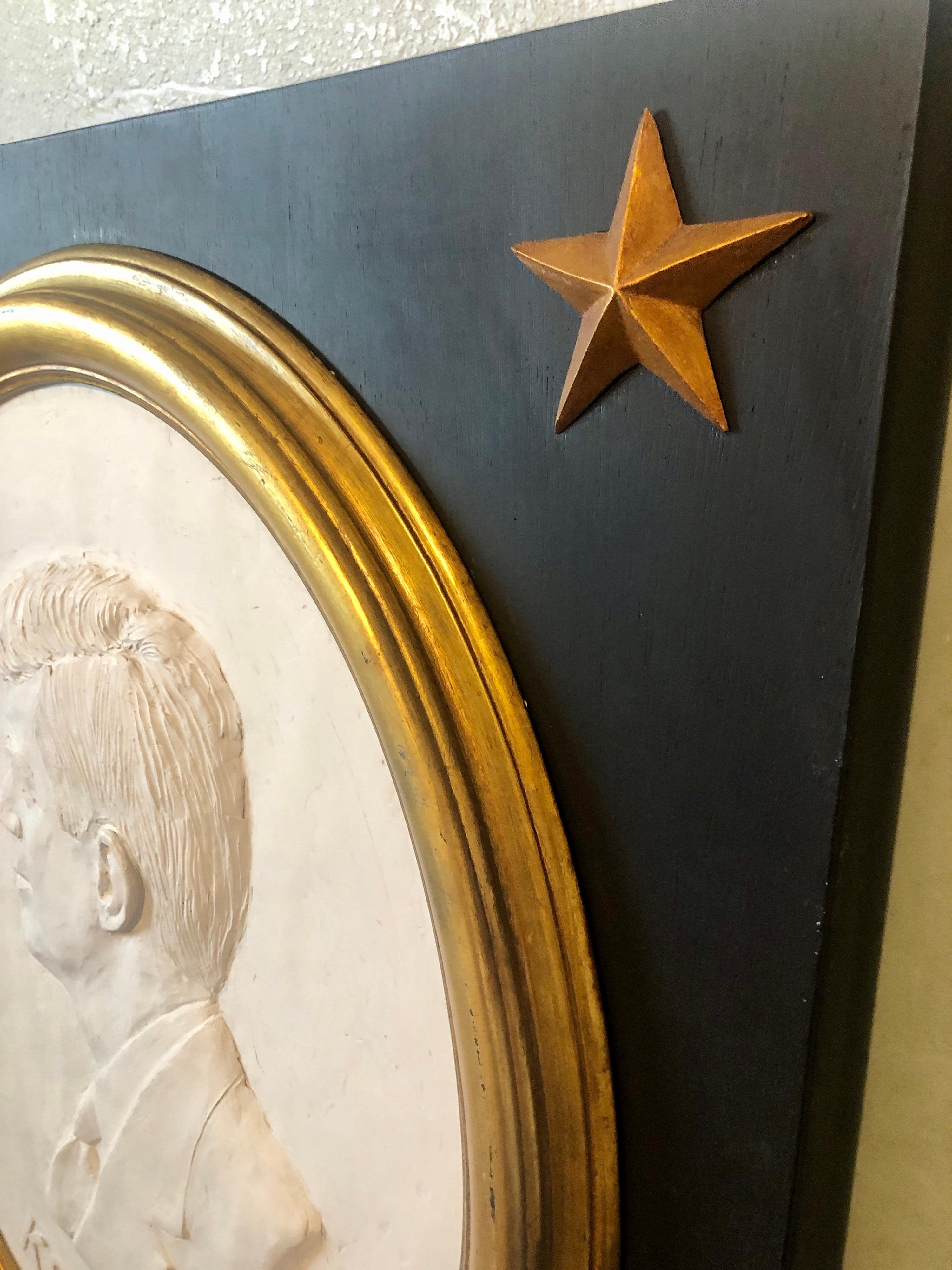 David Pryor Adickes American (b. 1927)
John F. Kennedy bas-relief plaster relief sculpture in artists frame incised signature lower center. with gold stars.
Deep relief, approximately 1 inch deep
Provenance: from the collection of Francine Coffey