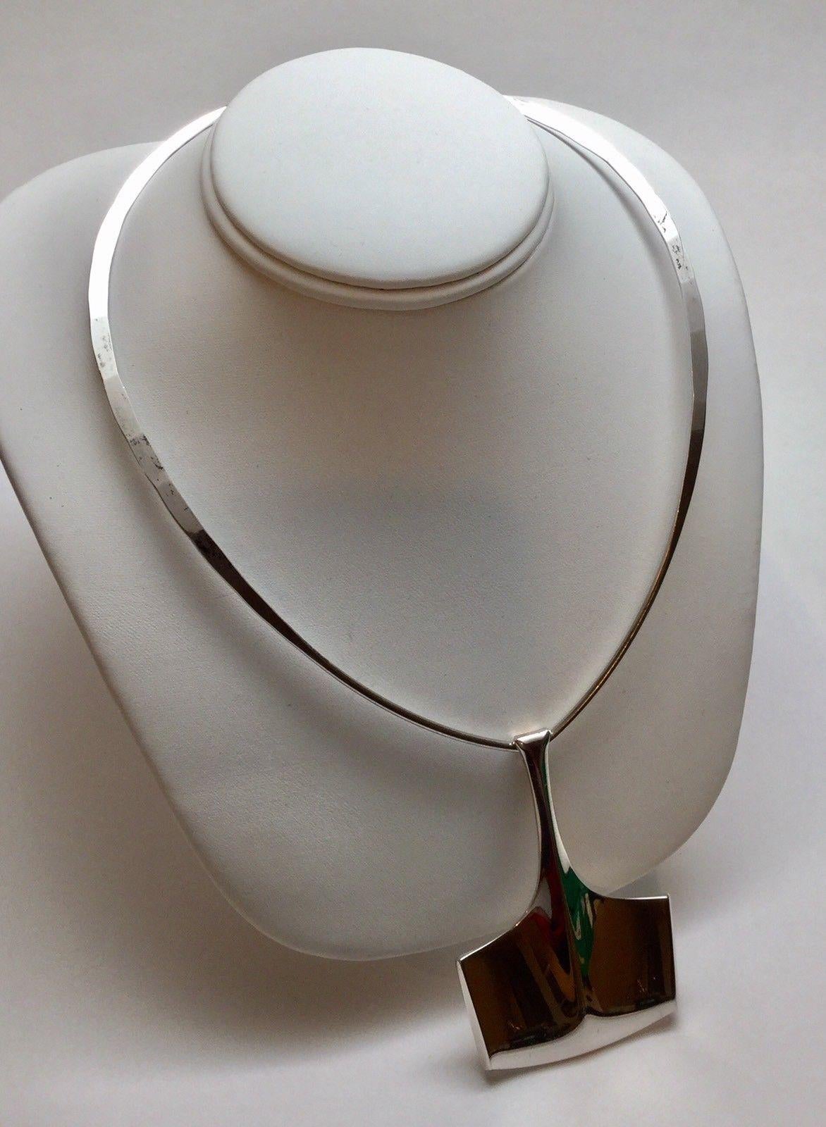 Vintage Bjorn Sigurd Ostern for David-Andersen Norway sterling silver Thor's Hammer pendant on David-Andersen hammered sterling silver collar necklace.

c. 1960's

Pendant: 
Marked - DAVID ANDERSEN NORWAY STERLING 925S, INV.B.S.O. for Bjorn Sigurd