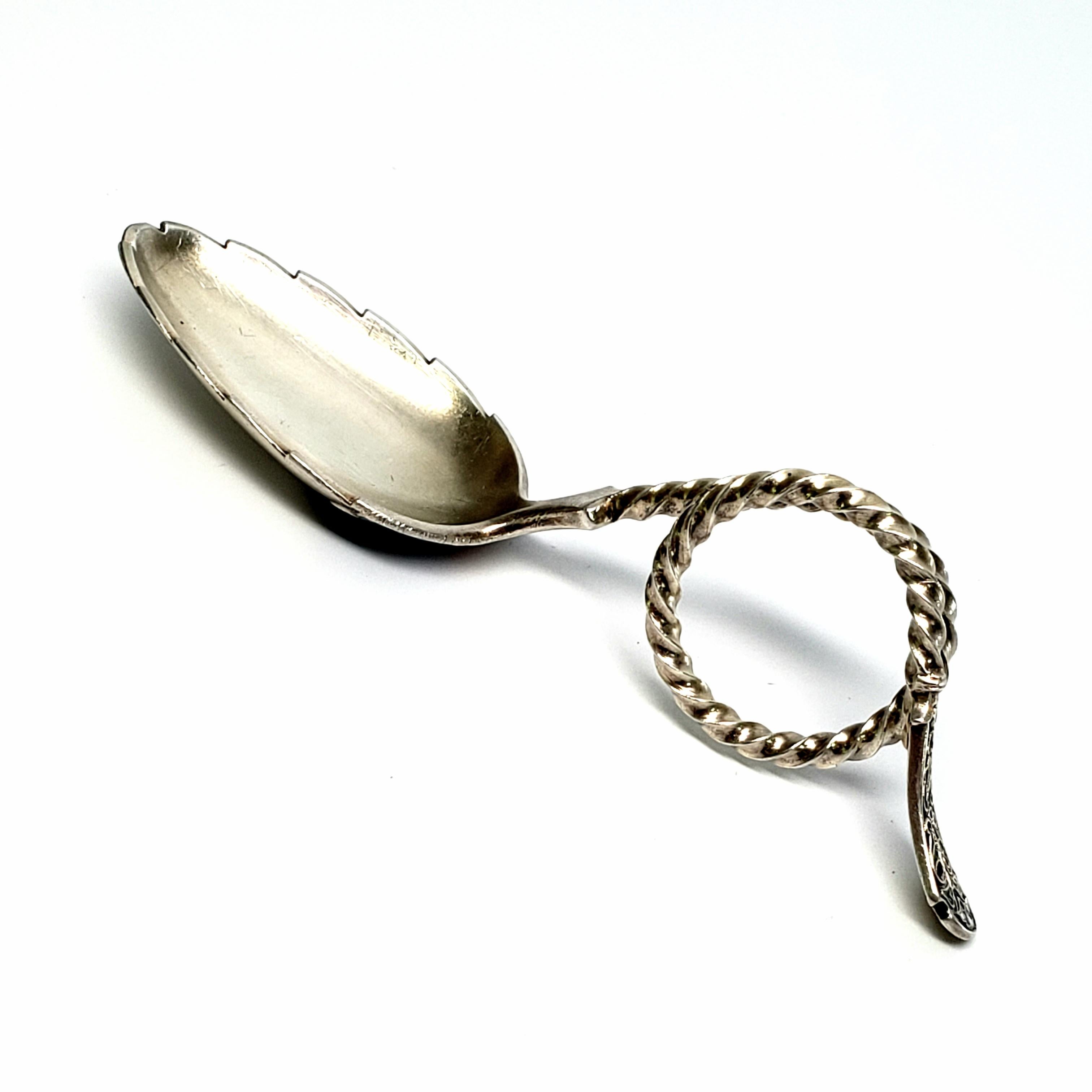 Vintage sterling silver spoon by David Andersen Norway. Early David Andersen hallmark dates the piece between 1888-1925.

Beautiful cloisonné enamel work on the back of the bowl, and the top, front of the handle. Serated design around the edge of