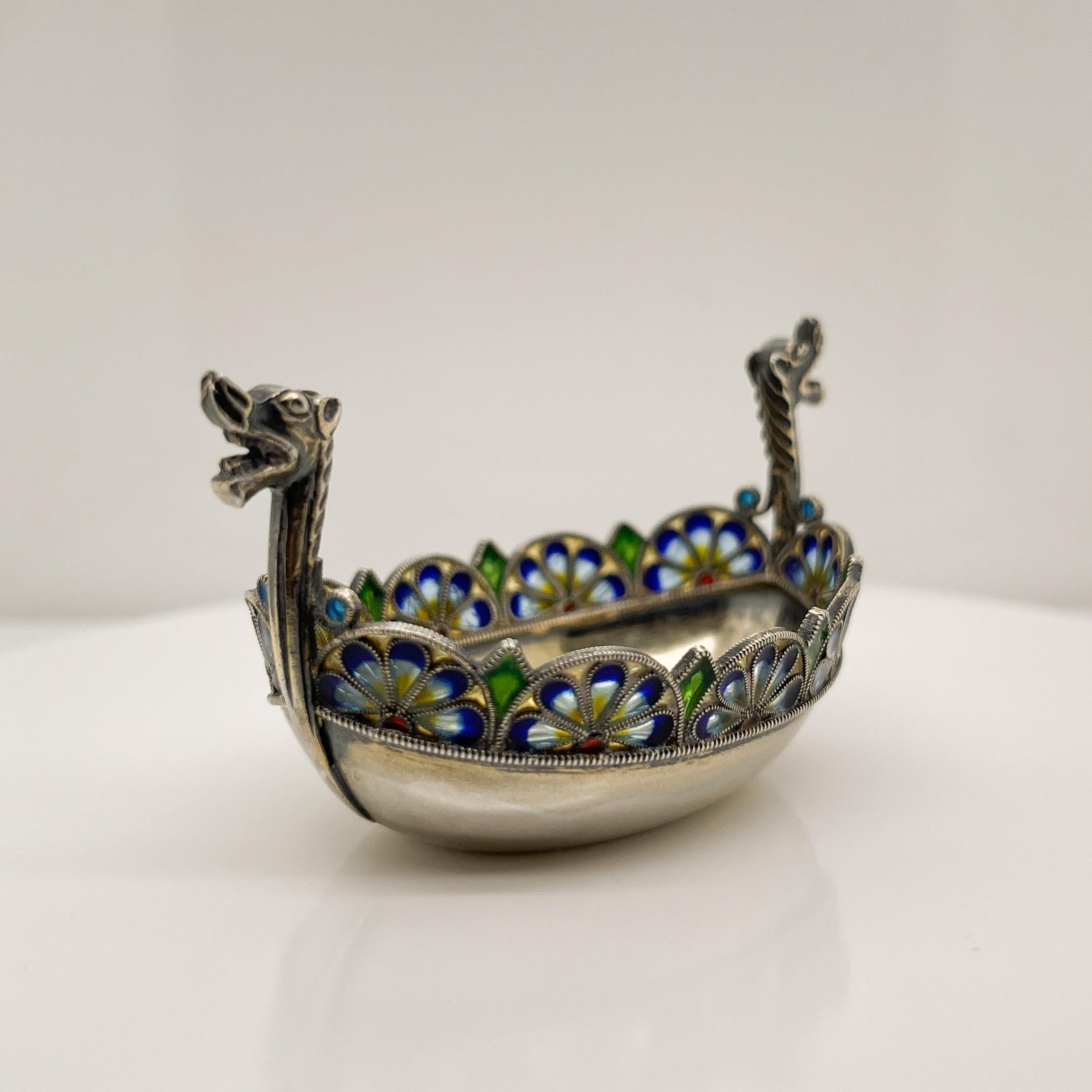 A very fine sterling silver and plique a jour enamel salt cellar.

Modeled as a Viking boat.

With remnants of its original gilding.

Simply a terrific piece!

Date:
Late 19th or Early 20th Century

Overall Condition:
It is in overall good,