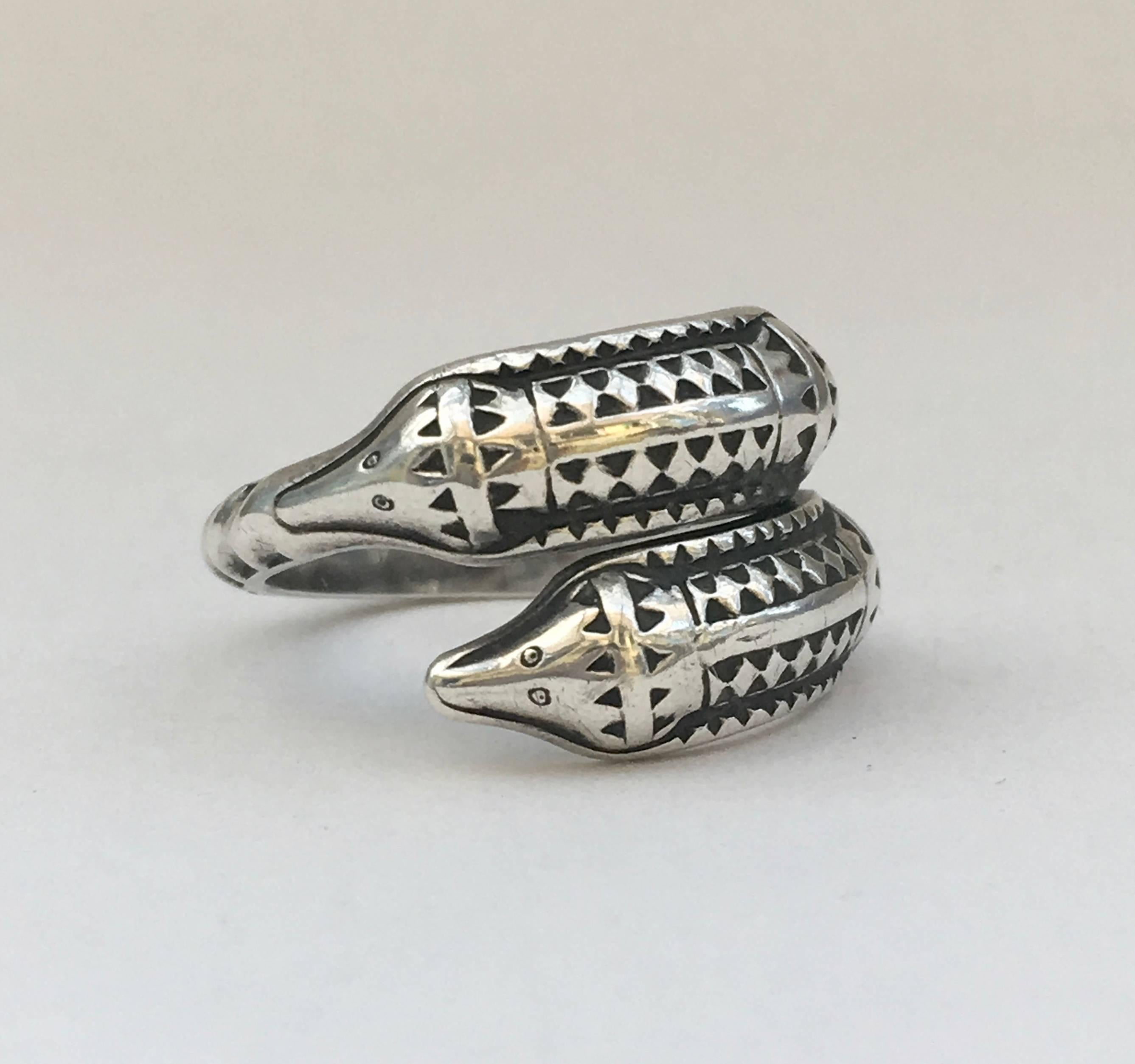This unusual sterling silver snake ring is strikingly reminiscent of Viking jewellery and the markings tell us that it is indeed a copy of an original piece dating back to 300 A.D. 

Created by well-known designer, David Andersen of Norway (founded