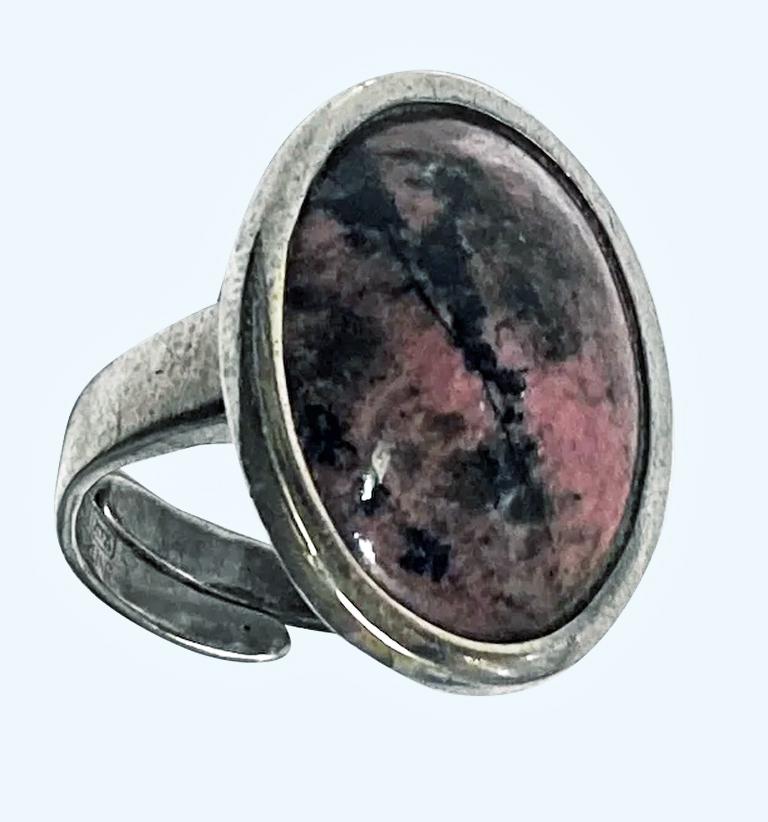 David Andersen Sterling and Thulite Ring Norway C.1950. The Ring bezel set with large thulite gauging approximately 16 x 9 mm, twist design plain tapered shank. Total Item Weight: 14.7 gm. Ring size: 7.5