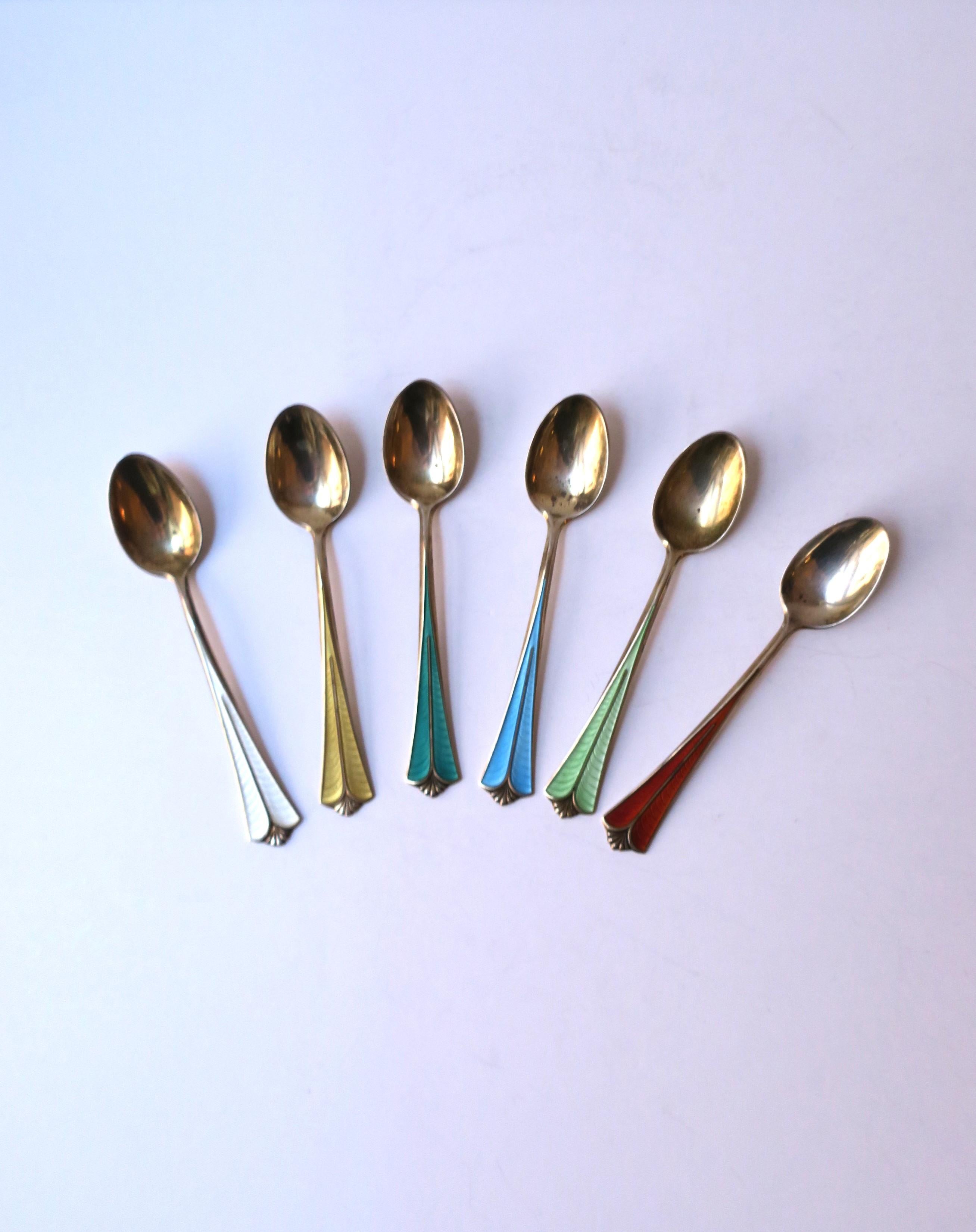 A beautiful set of six (6) sterling silver, gold gilt, and guilloche enamel espresso coffee or tea demitasse spoons from Norwegian silversmith firm, David Andersen, circa early-20th century, Norway. Firm was founded 1876 in Christiania (now Oslo),