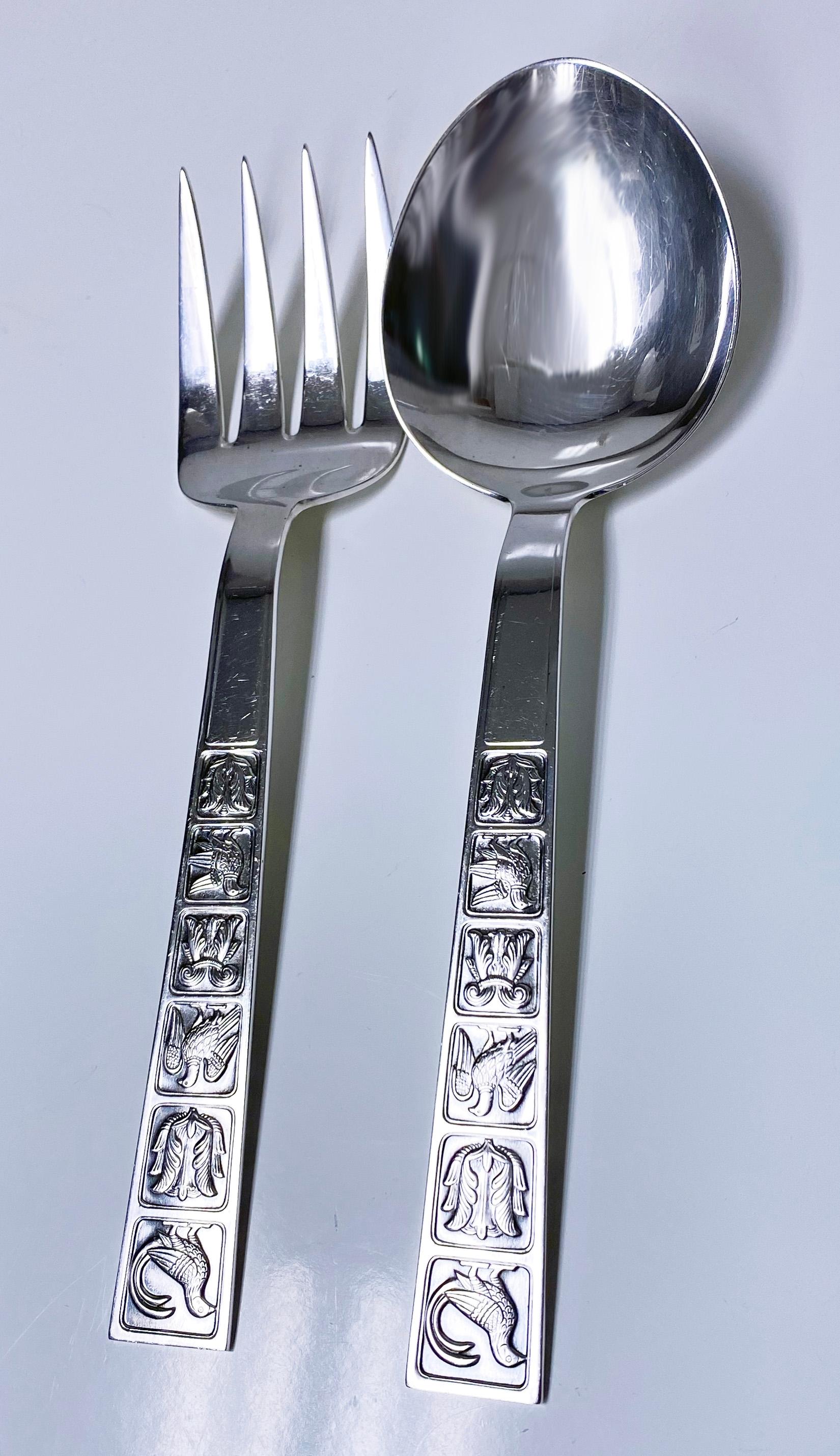 David Andersen sterling silver servers Norway C.1960. Wide shape, rectangular handle ends, decorated with relief tiles and traditional Scandinavian folk motifs: birds and stylized flowers. Full marks for David Andersen Norway Sterling. Total weight