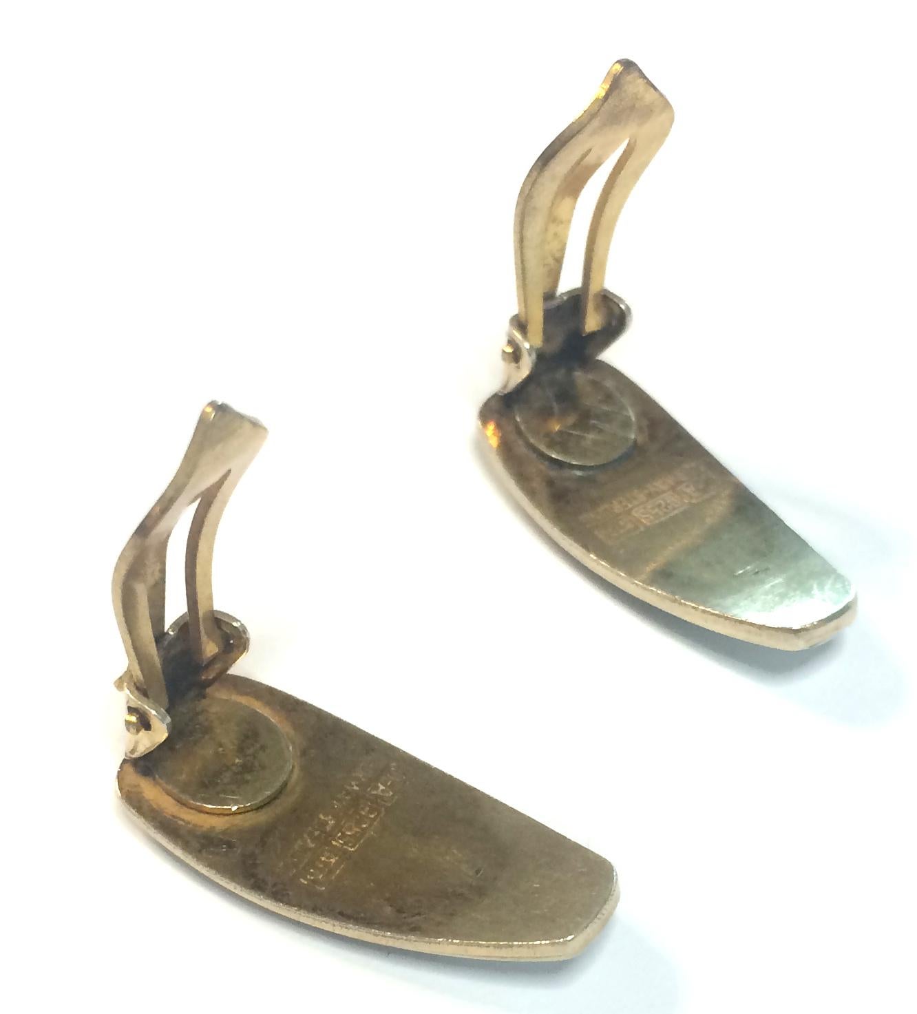 David Andersen pair of matching earrings, a Norwegian silver-gilt and enamel convex rectangular 'bubble' enamel with stylised curves approx 2.5cm, total gross enamel intact, small chip to enamel on earring as per photograph.  Full marks for silver,