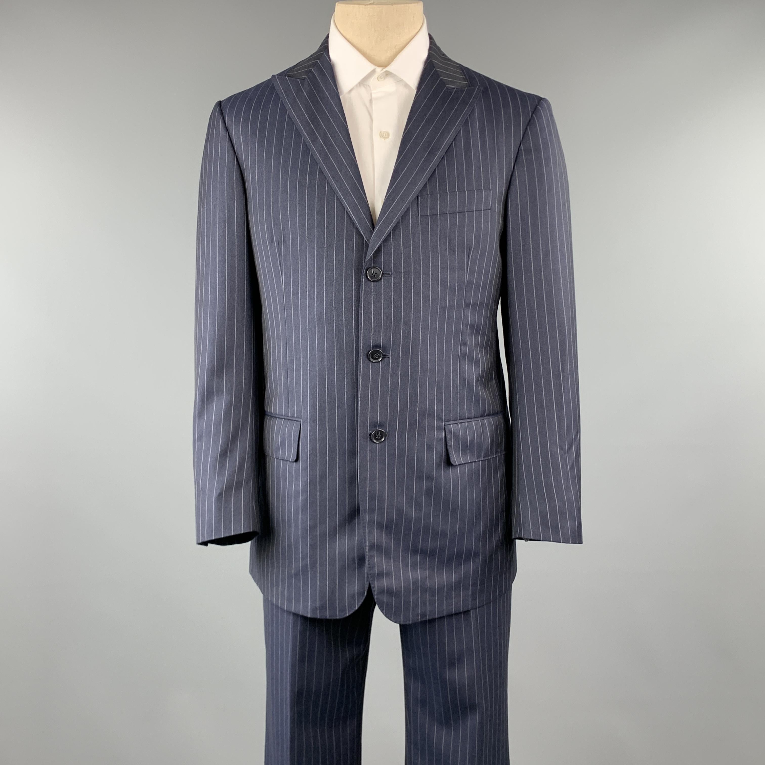 DAVID AUGUST suit comes in a navy & gray striped wool and includes a single breasted, three button sport coat with peak lapel and matching front trousers. Made in USA.

Pre-Owned Condition.
Marked: ( No Size Marked