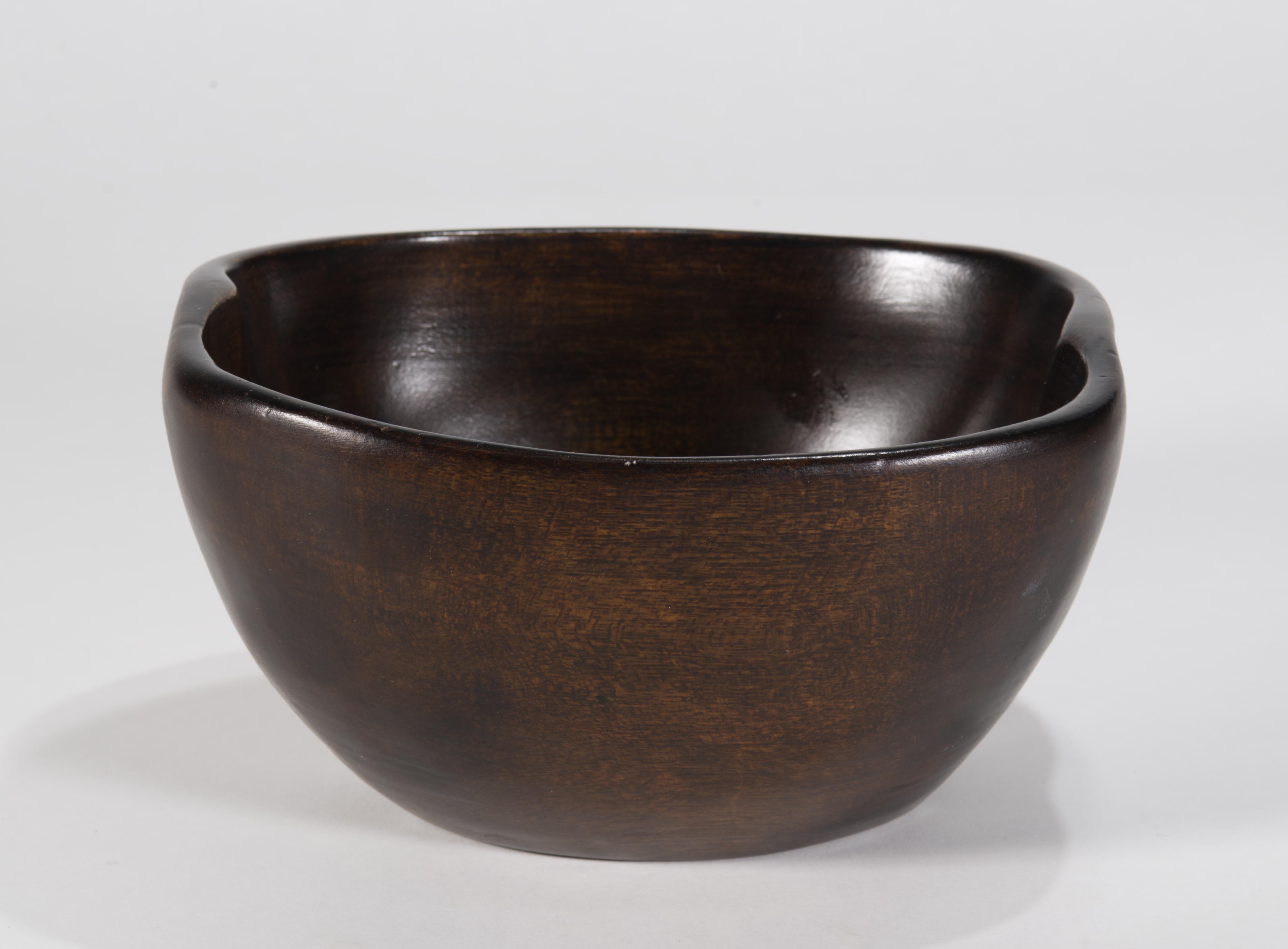  Sculptural Organic Modern carved wooden bowl features asymmetrical shape with soft, flowing outline and curved rim; minimal design of the bowl accentuates the beautiful natural grain of the wood and the craftsmanship of the carver.

The bowl is in