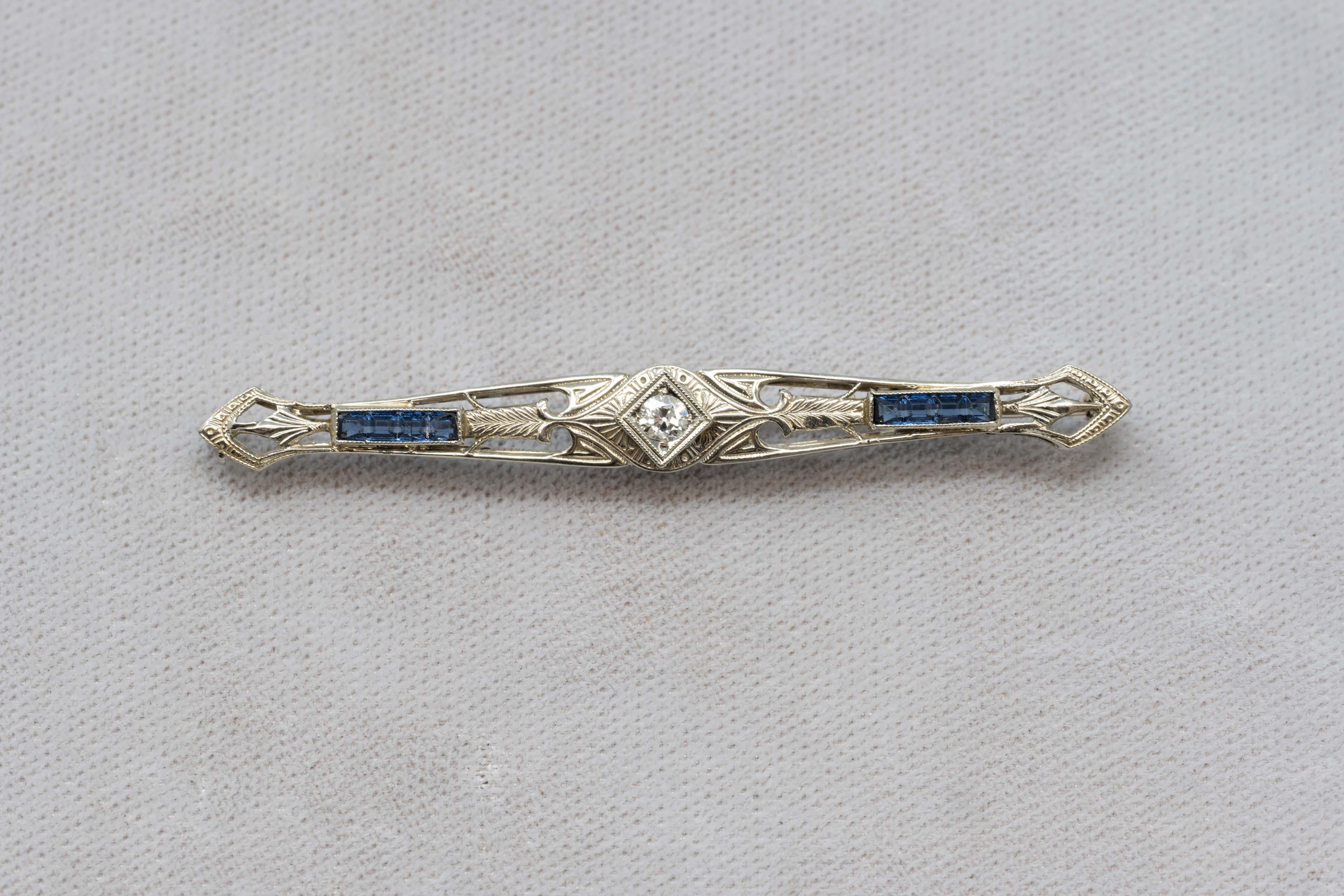 Art deco 18k white gold brooch made in the USA by Belais Manufacturing Co. Founded by David Belais 1863-1933 who was the first manufacturer of white gold in the USA. The brooch is set with diamonds of .12 ct, VS clarity and GH color plus blue
