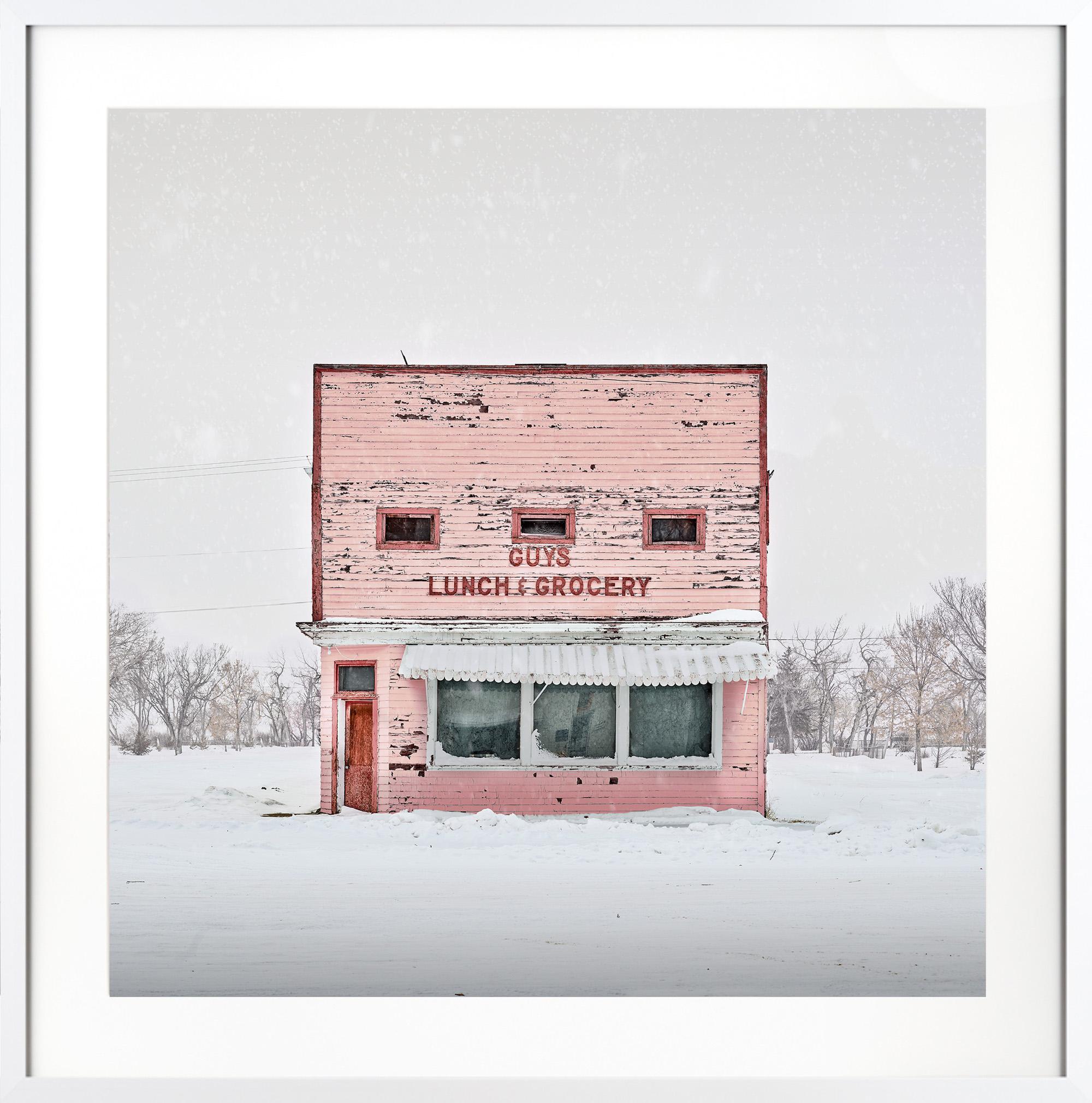 David Burdeny Color Photograph - "Guy's Lunch & Grocery, Saskatchewan, Canada" Dynamic Photo with Snowy Backdrop