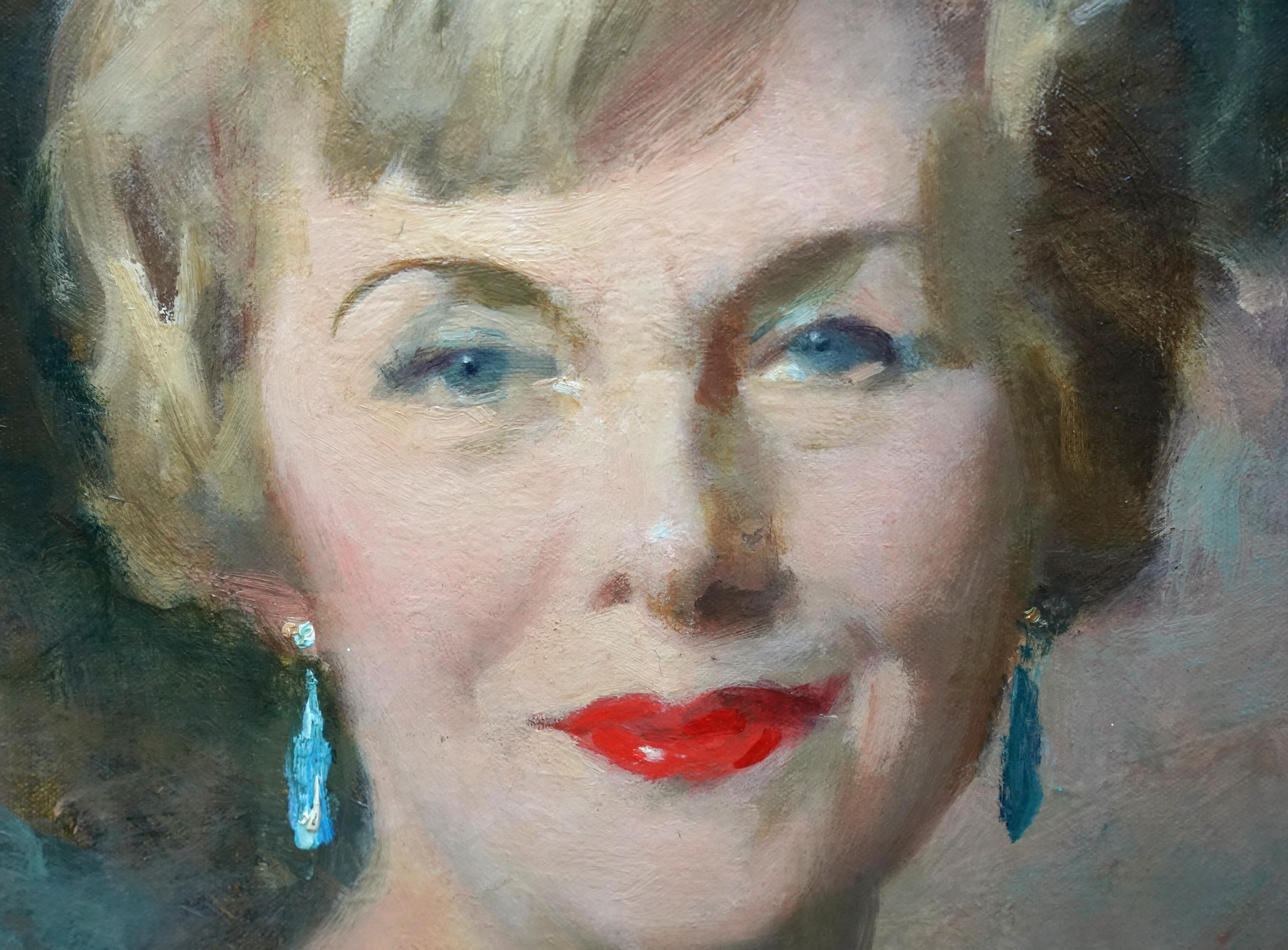 This superb British portrait oil painting is by noted Scottish artist David Cowan Dobson, better known as Cowan Dobson. Painted circa 1950 it is a bust length oil painting of a sophisticated and stylish blonde lady. She is wearing an off the