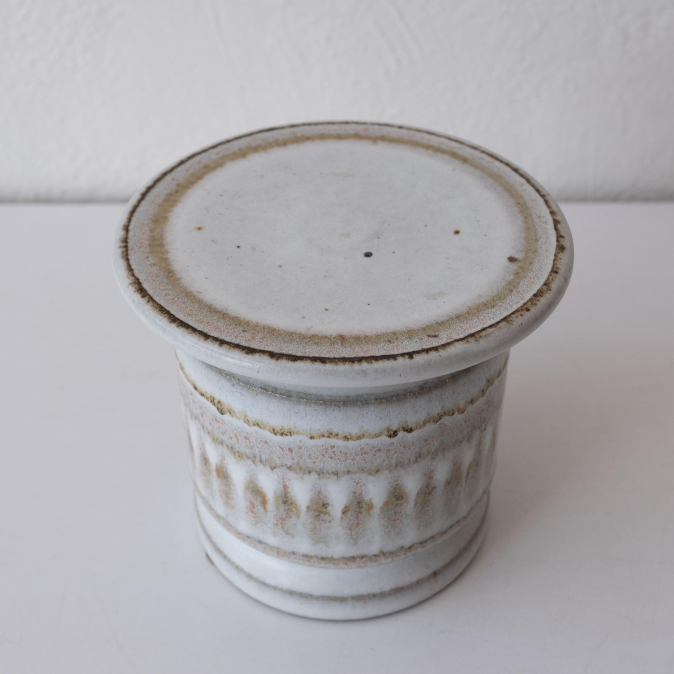 Stoneware pedestal or column candle holder by David Cressey and Robert Maxwell for their company, Earthgender. 

Signed on the bottom. 1970s.