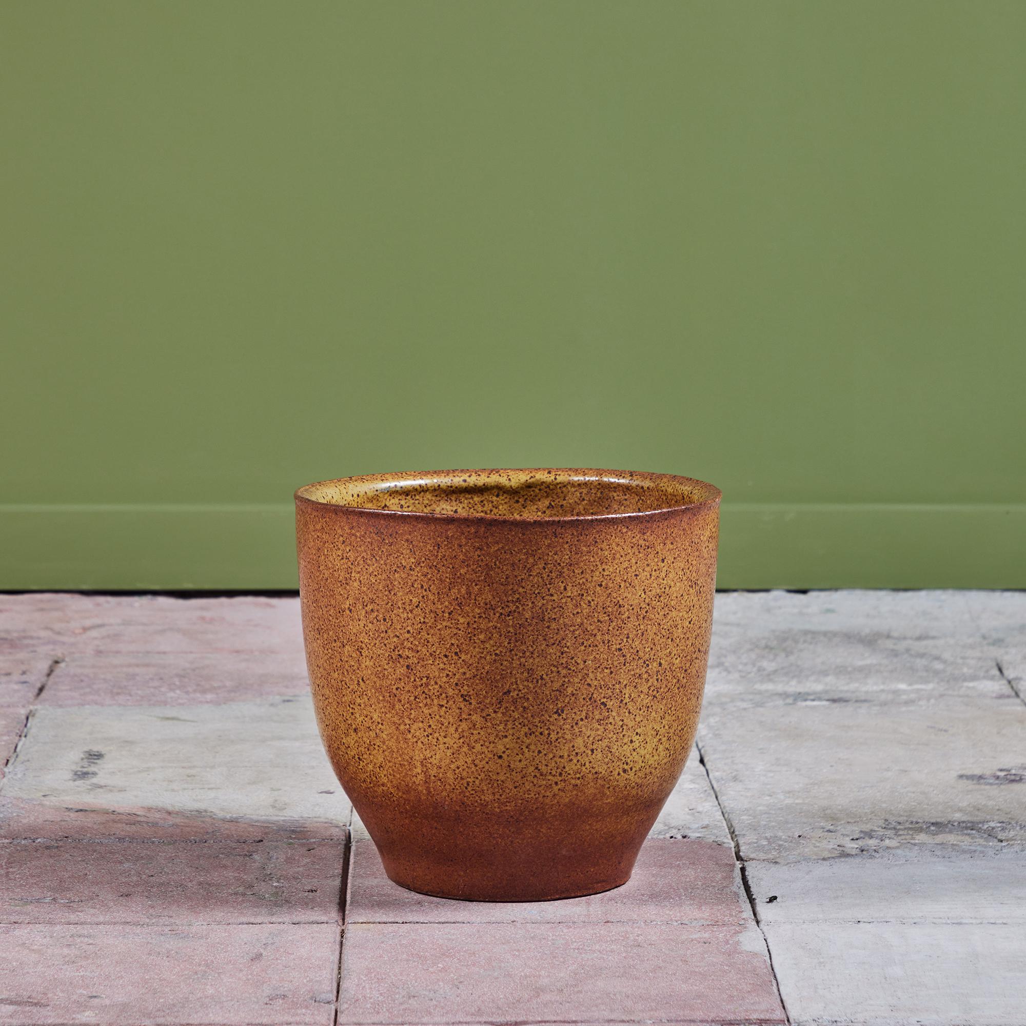 David Cressey Pro/Artisan collection Planter for Architectural Pottery. This stoneware planter has a sienna yellow glazed interior and exterior. The top of the planter has slightly bowed sides and a flattened lip while the bottom tappers inwards.