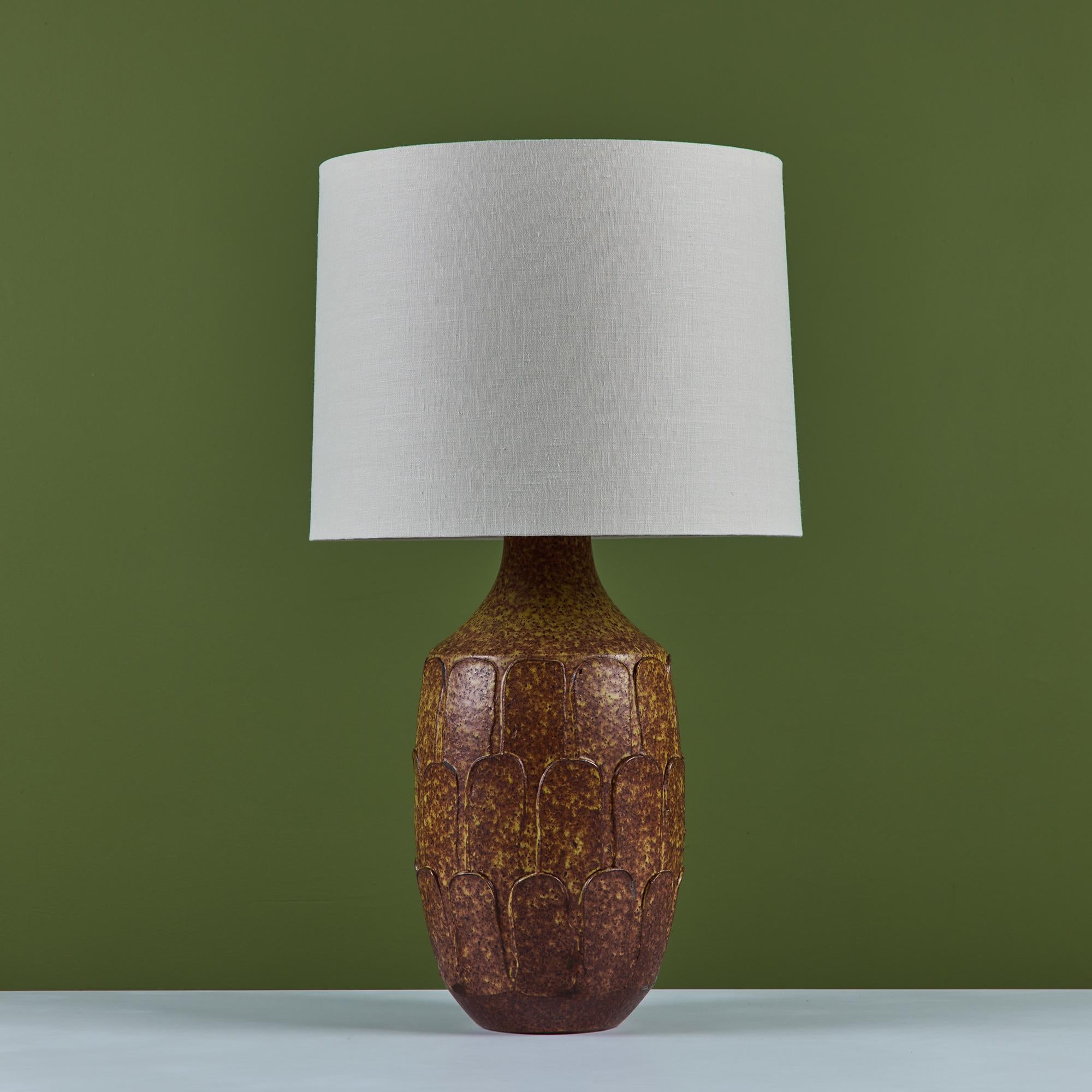 David Cressey glazed stoneware table lamp, for Architectural Pottery's Pro Artisan Collection, c.1960s, USA. The wheel thrown stoneware lamp features the iconic leaf pattern throughout the lamp base with a brown and yellow speckle glaze. The newly