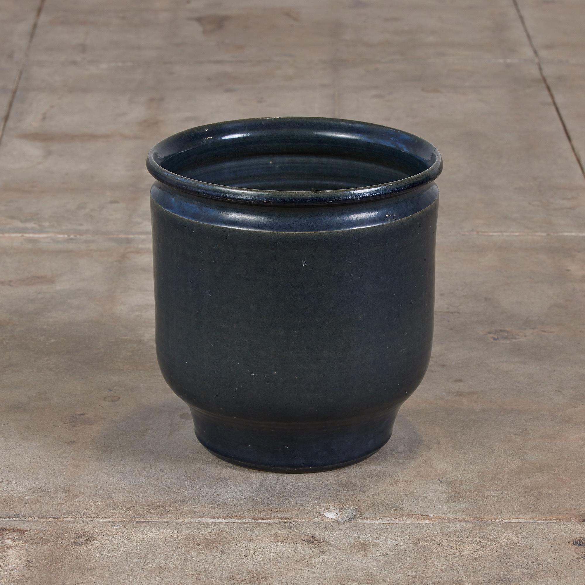 Tulip glazed ceramic planter from David Cressey's Pro/Artisan collection for Architectural Pottery. The planter has a deep blue glazed exterior and interior, with slightly bowed sides and a rounded lip. 

Dimensions: 13