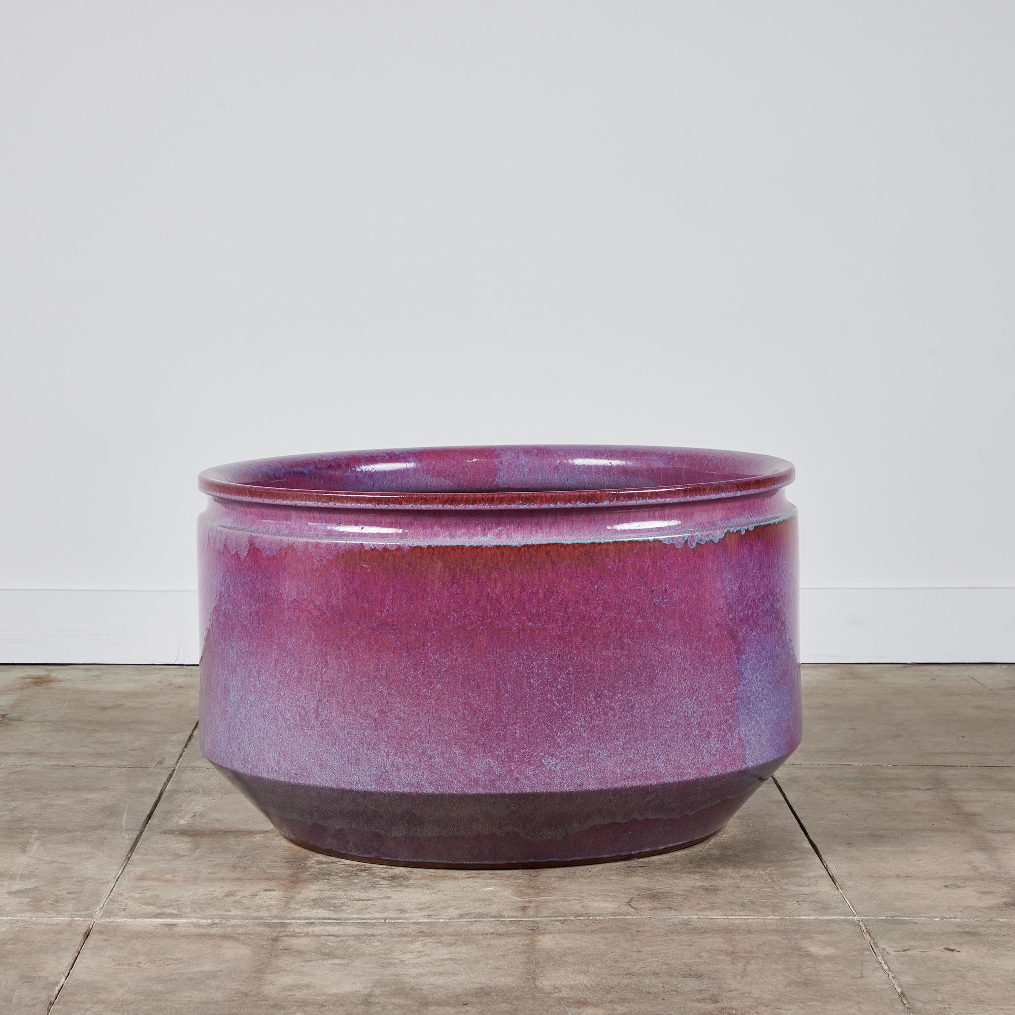 A large ceramic bowl planter from David Cressey and Robert Maxwell for Earthgender. The planter has an ombre glazed interior and exterior ranging in colors of purple, pink and blue with slightly bowed sides and a flattened lip. 

Dimensions
32.5