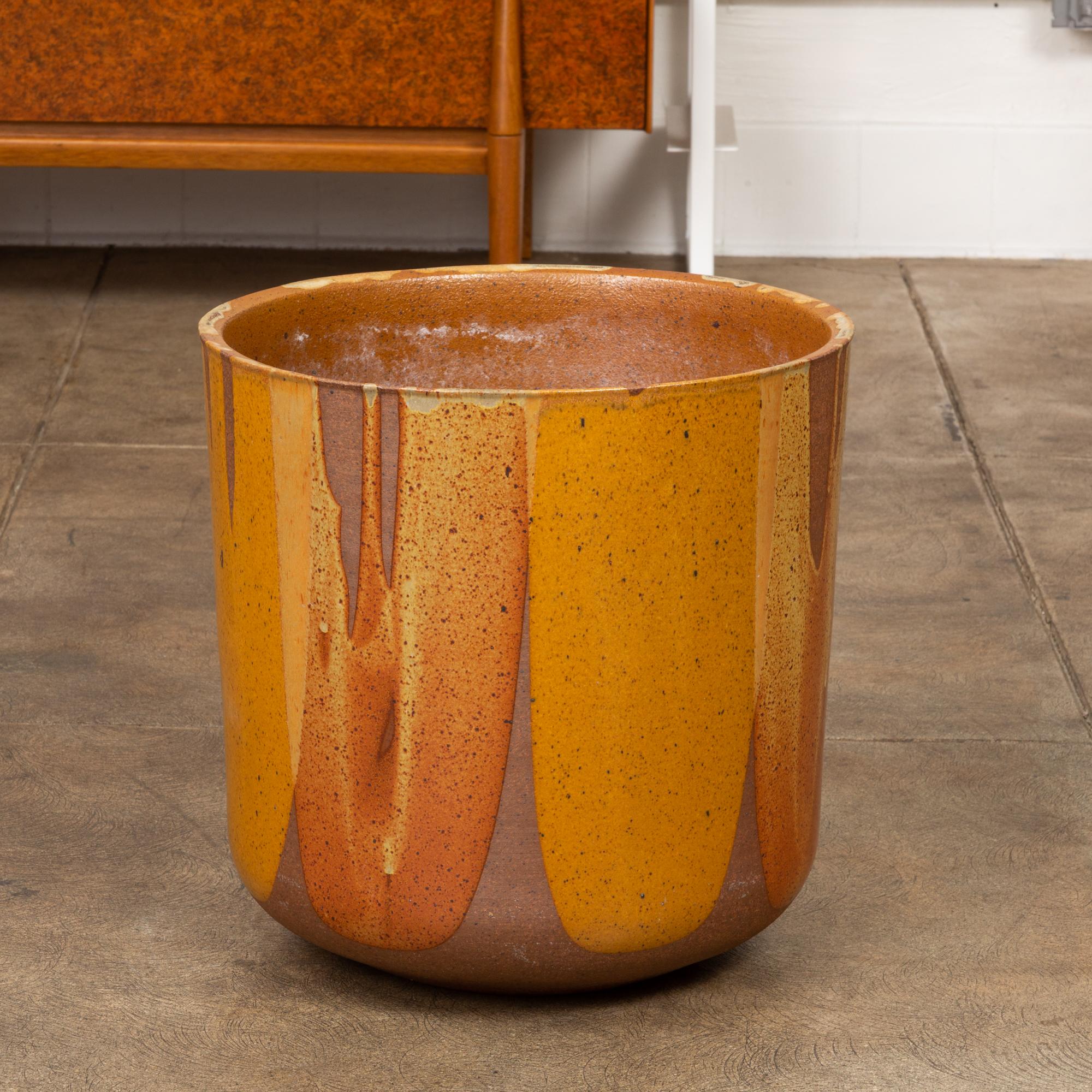 A tulip-shaped LT-24 planter for Architectural Pottery with David Cressey's Pro/Artisan “Flame Glaze.” This planter shape was designed by Malcolm Leland and has a rounded bottom that widens towards the opening, a simple shape rendered dramatic by