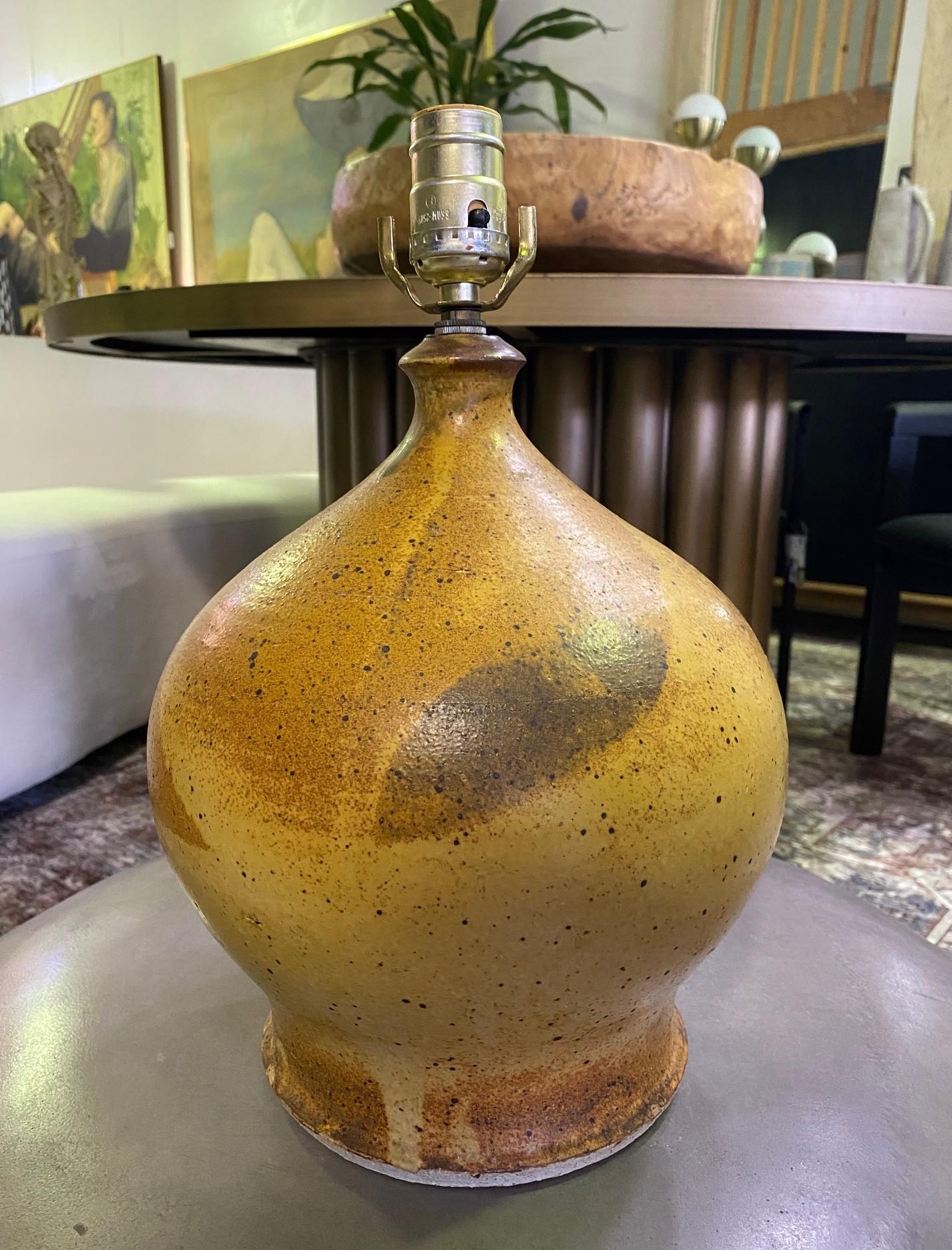 A wonderful speckle glazed lamp by famed American California Archectual potter David Cressey. This is an early work done while David was at UCLA working with Laura Andreson. 

Cressey was born and raised in Los Angeles, California. He attended the