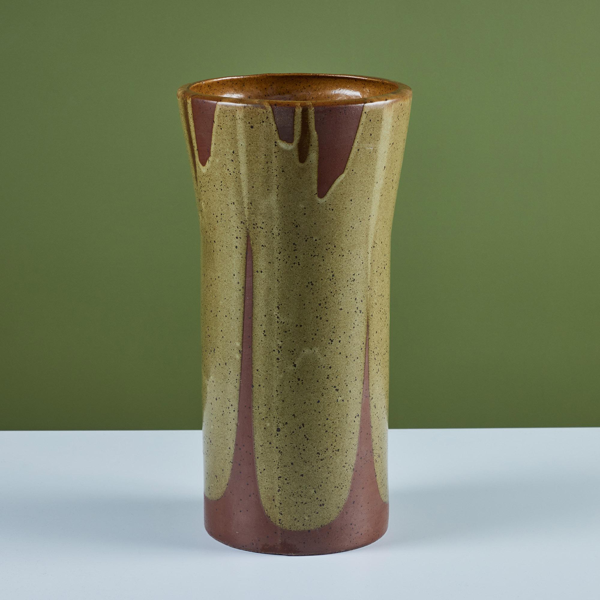 Planter by David Cressey for Architectural Pottery's Pro/Artisan collection with Cressey’s signature “Flame Glaze” in yellow and orange tones. This planter has slightly bowed sides and a flattened lip.

Dimensions
10.25