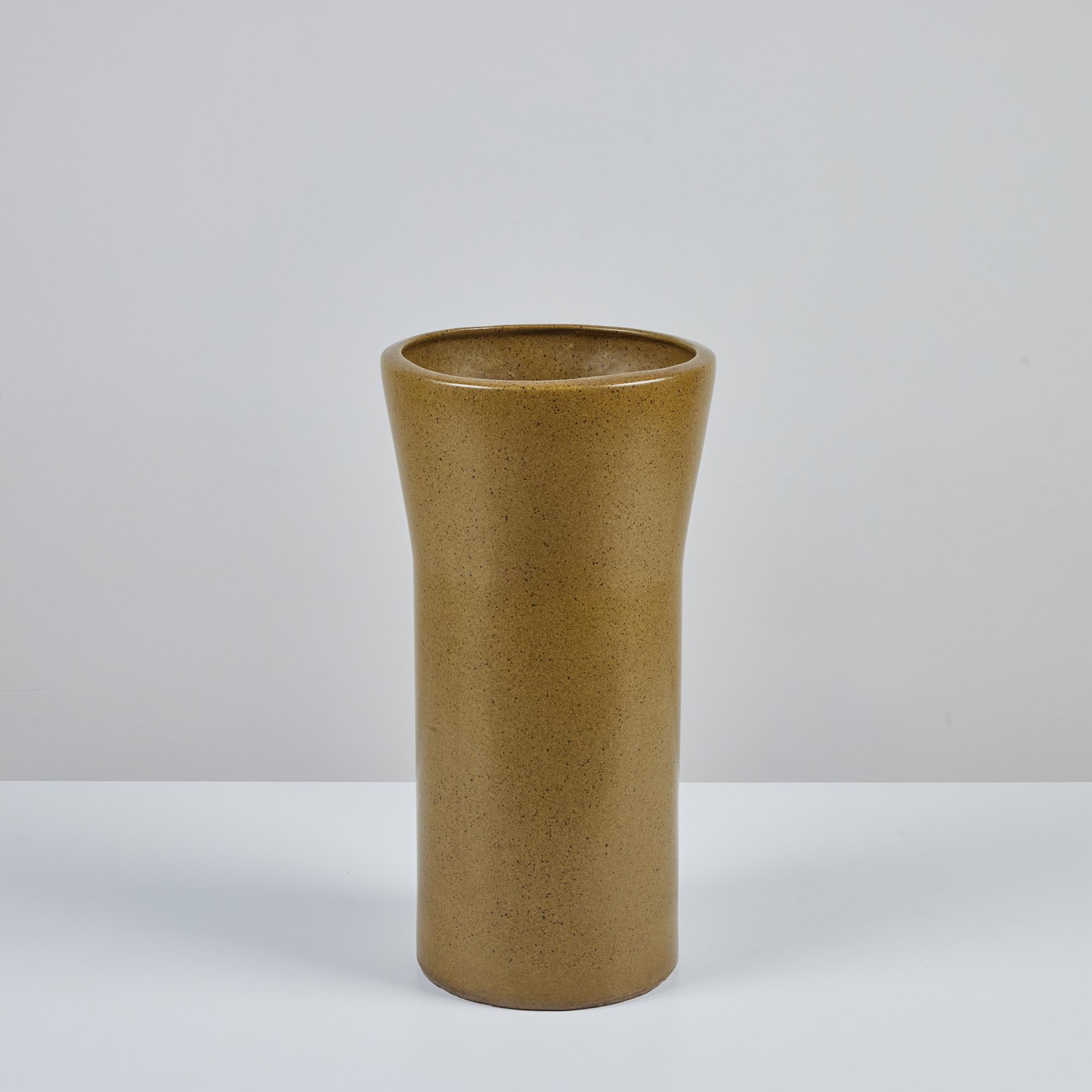 Planter by David Cressey for Architectural Pottery's Pro/Artisan collection. This planter has a soft olive green speckle glazed exterior and interior. The top of the planter has slightly bowed sides and a flattened lip.

Dimensions
10.5