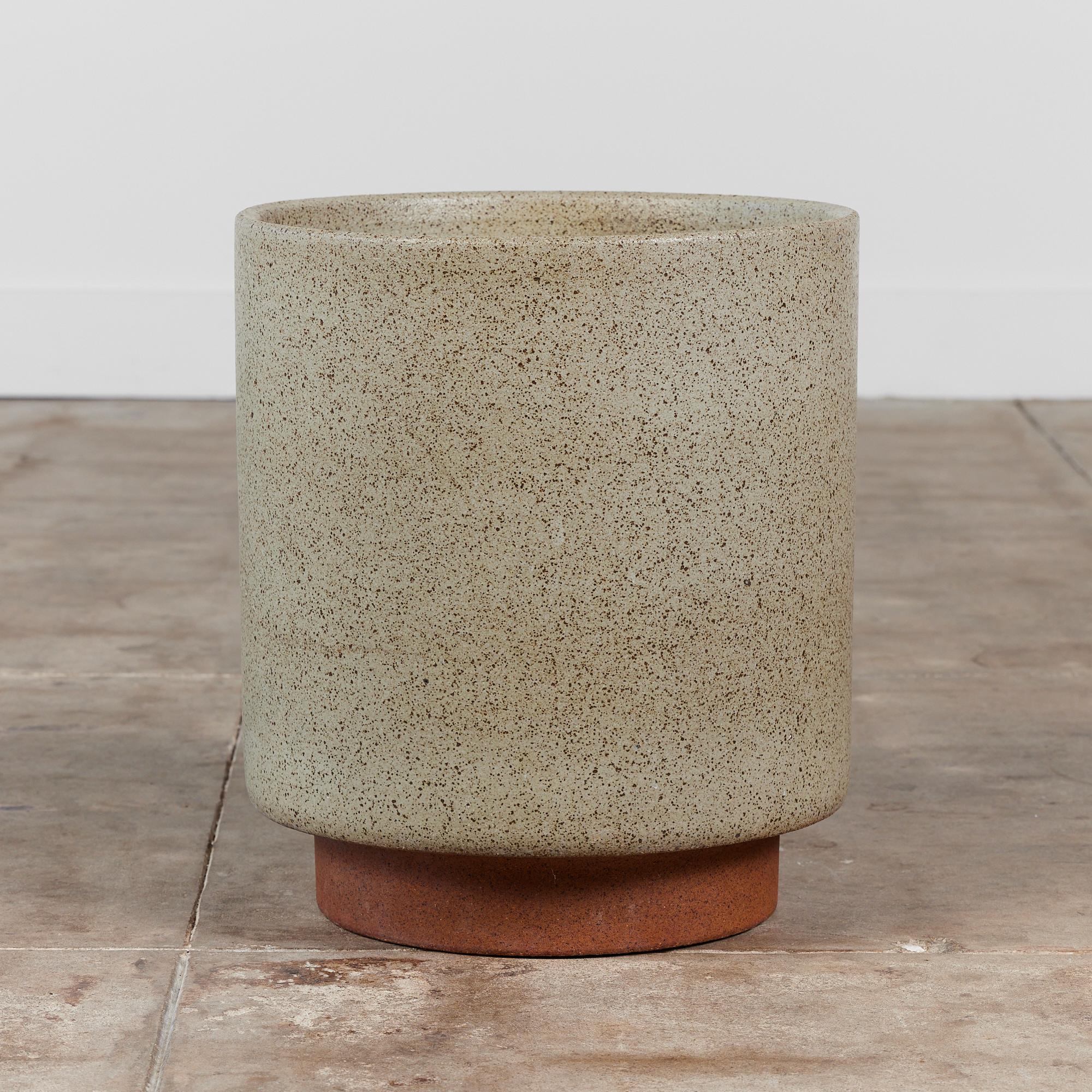 Ceramic planter from David Cressey's Pro / Artisan collection for Architectural Pottery. The 4043 / R cylindrical planter has a stone white speckle glazed exterior and interior, with rounded stoneware base. 

Dimensions
?17