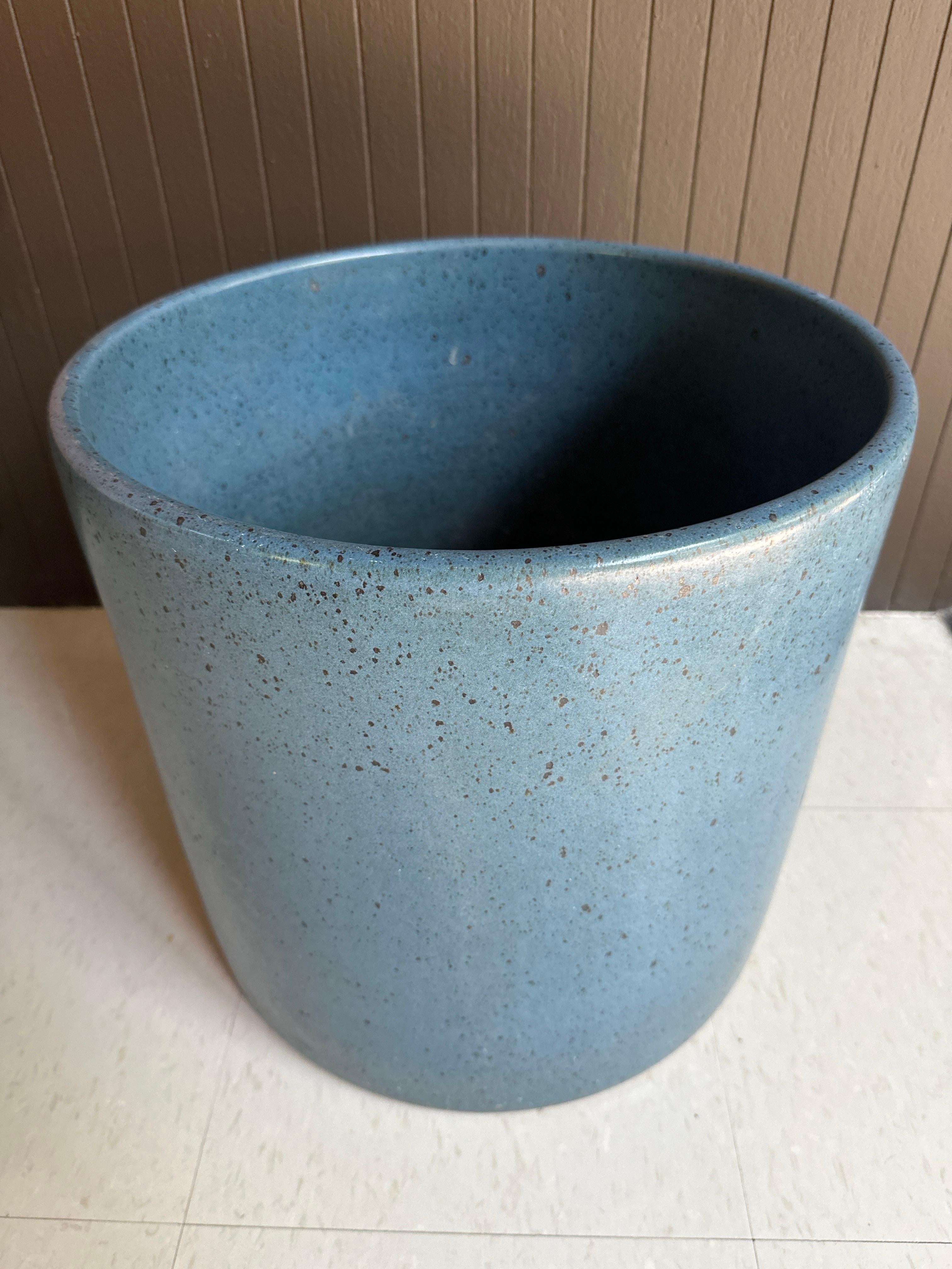 Architectural pottery, cylindrical planter in soft blue glaze with dark brown speckles showing beautiful textured variation throughout the planter body.

Planter has no flaws and is not drilled or drainage. 

Shipping from Orange, CA.