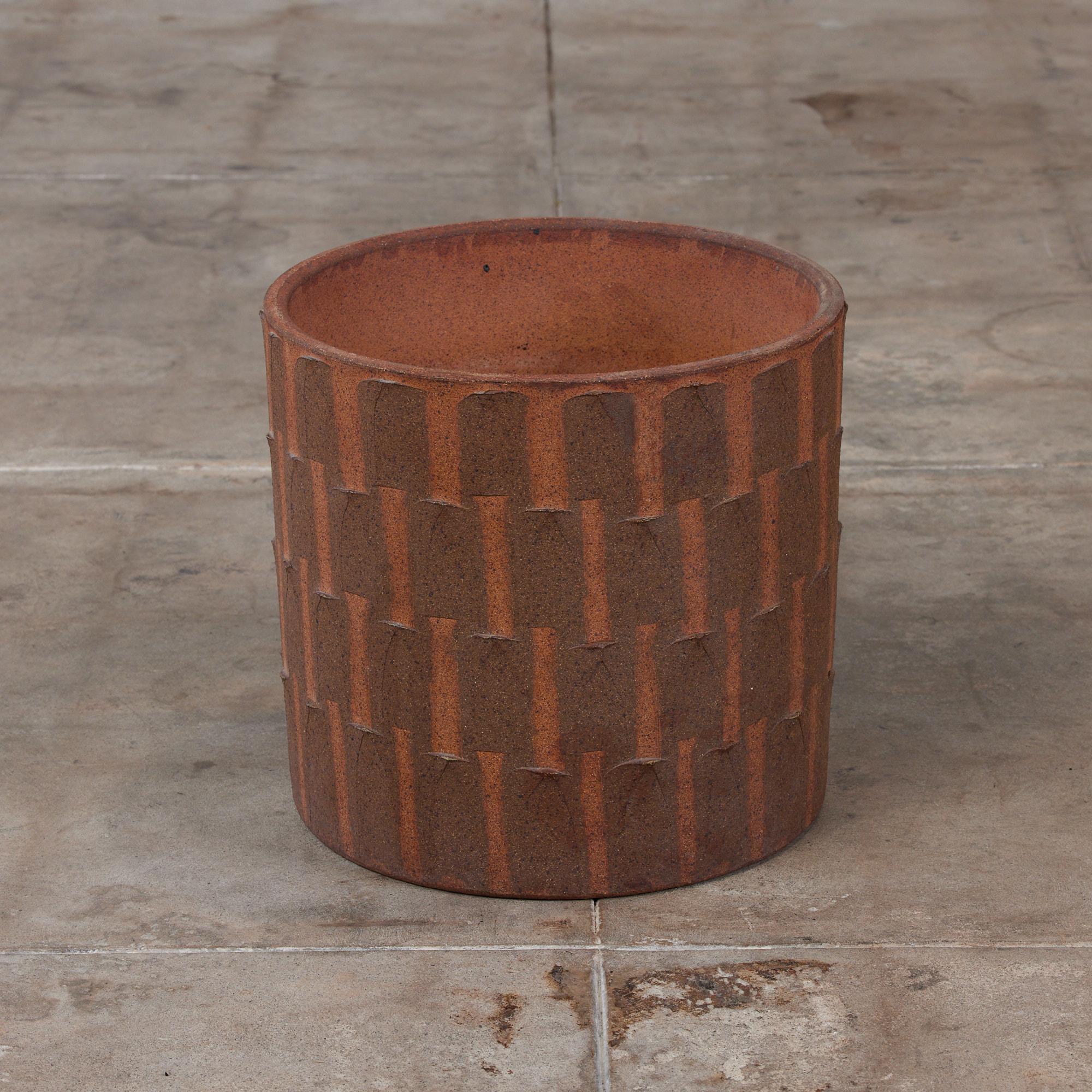 Cylindrical ribbed planter by David Cressey from the Pro/Artisan collection for Architectural Pottery. This stoneware planter has a soft speckled unglazed interior as well as an unglazed natural warm brown clay exterior. 

Dimensions: 16