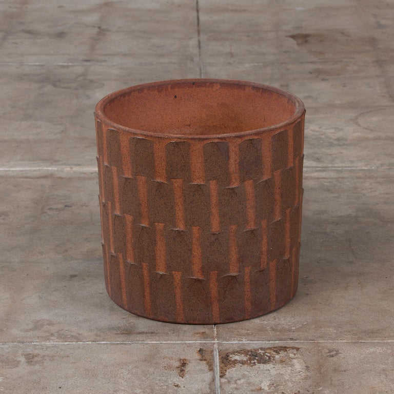 Cylindrical ribbed planter by David Cressey from the Pro/Artisan collection for Architectural Pottery. This stoneware planter has a soft speckled unglazed interior as well as an unglazed natural warm brown clay exterior. 

Dimensions: 16