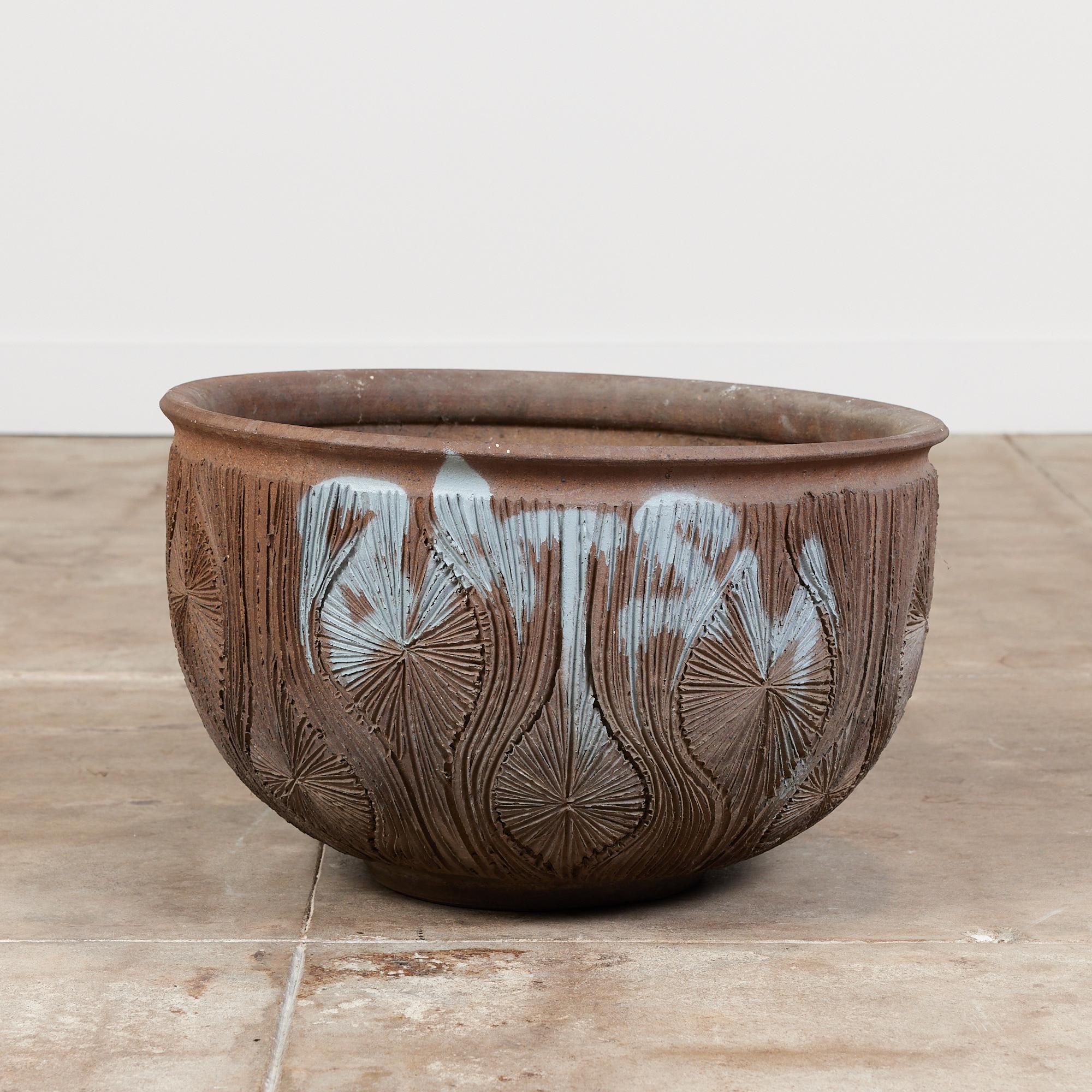 An unglazed stoneware bowl planter from David Cressey and Robert Maxwell's 1970s collaboration, Earthgender. The planter has a rounded lip, an incised all-over pattern in the 