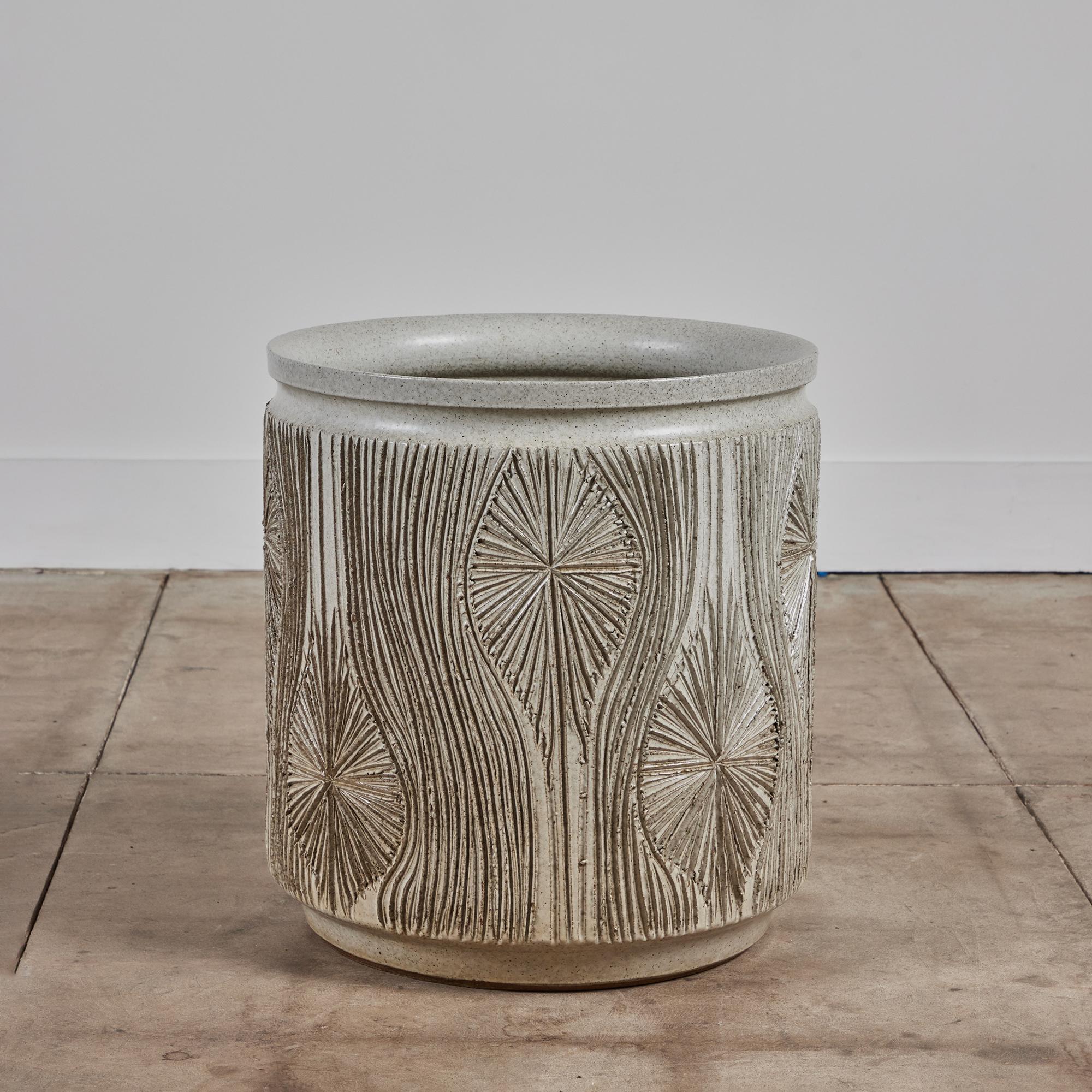 Cylindrical planter from Earthgender, David Cressey and Robert Maxwell’s early 1970s project. This 19” diameter example is incised in the “Teardrop Sunburst” design with interlocking gestural curves separating a pattern of lines radiating from a