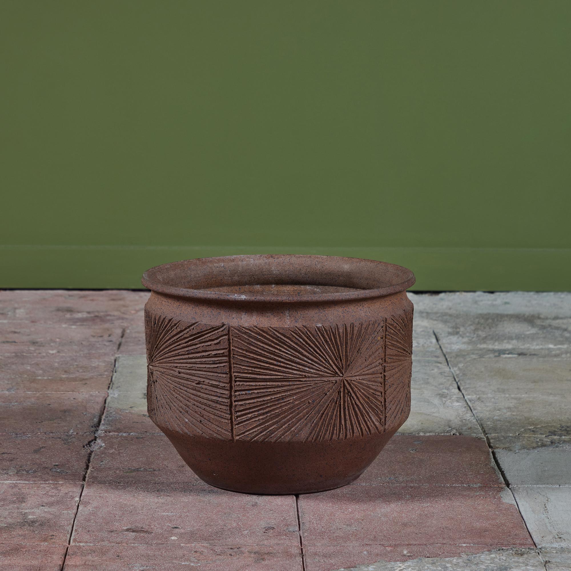 An unglazed stoneware bowl planter from David Cressey and Robert Maxwell's 1970's collaboration, Earthgender. The 15.5