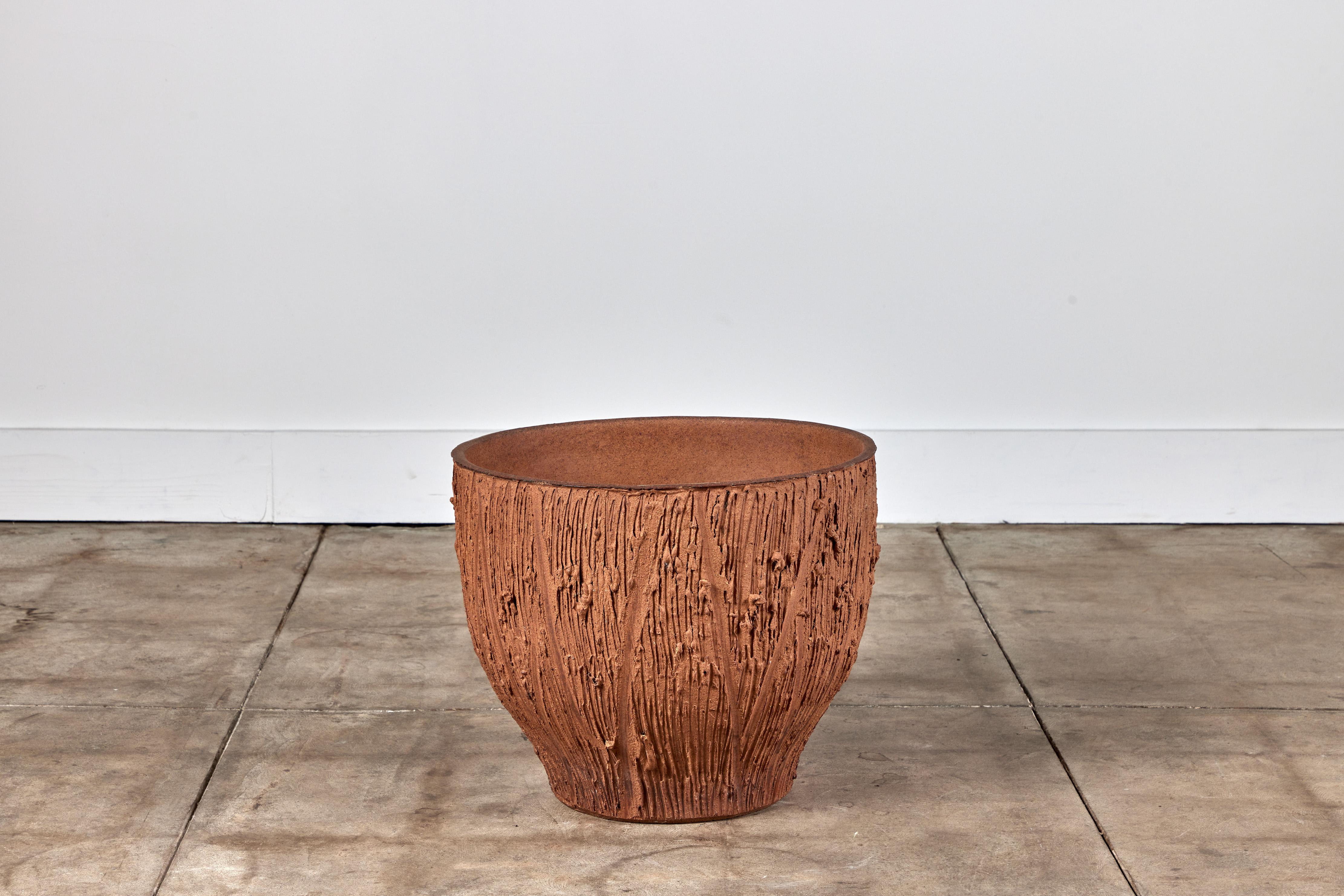 Planter by David Cressey from the Pro/Artisan collection for Architectural Pottery. This stoneware planter has an unglazed interior as well as an unglazed natural warm brown clay exterior with the iconic 