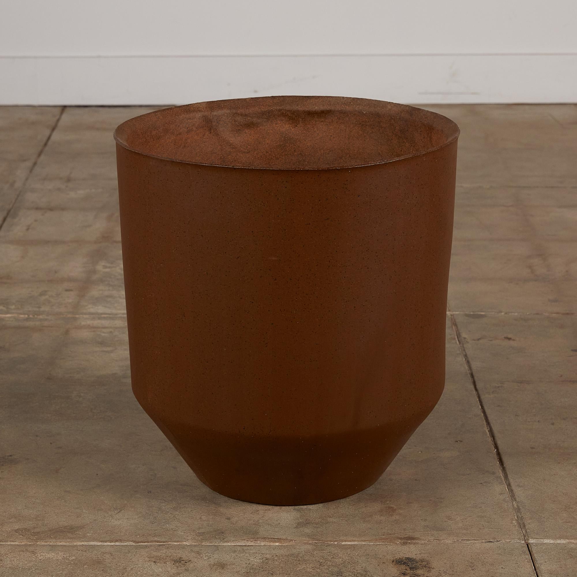 An AP-5049 planter by David Cressey from the Pro/Artisan collection for Architectural Pottery. This stoneware planter has a soft speckled unglazed interior as well as an unglazed natural warm brown clay exterior. The top of the planter has slightly