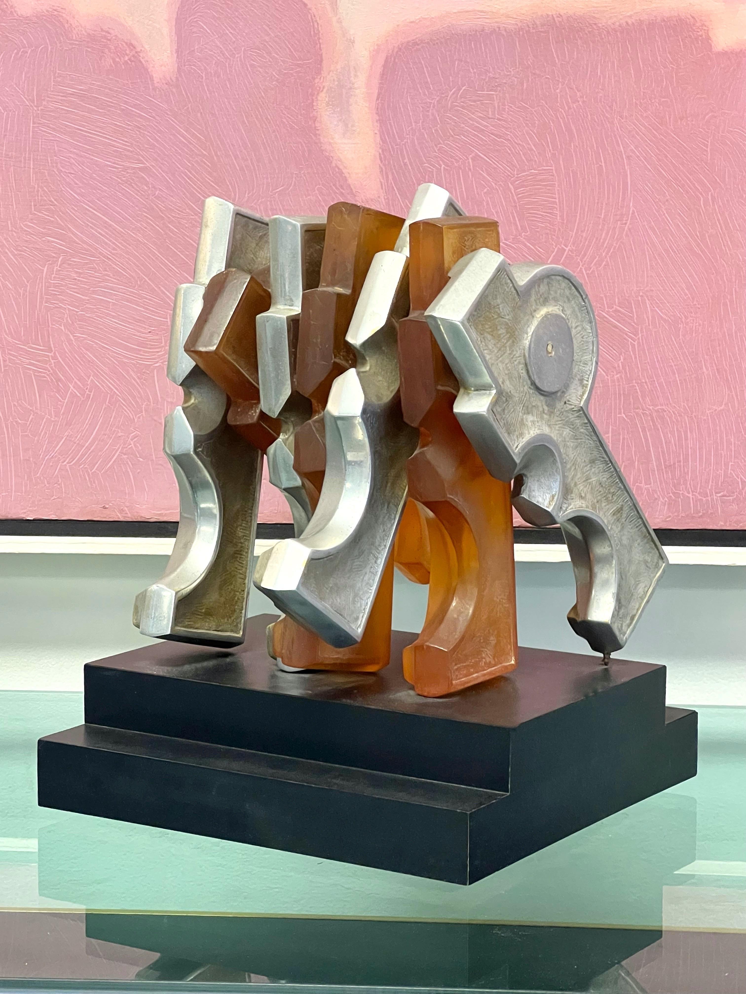 Modern sculpture by David Davies. Its is cast aluminum and resin. On a black laminate stepped base with signature on a brass plaque. Name of work is 