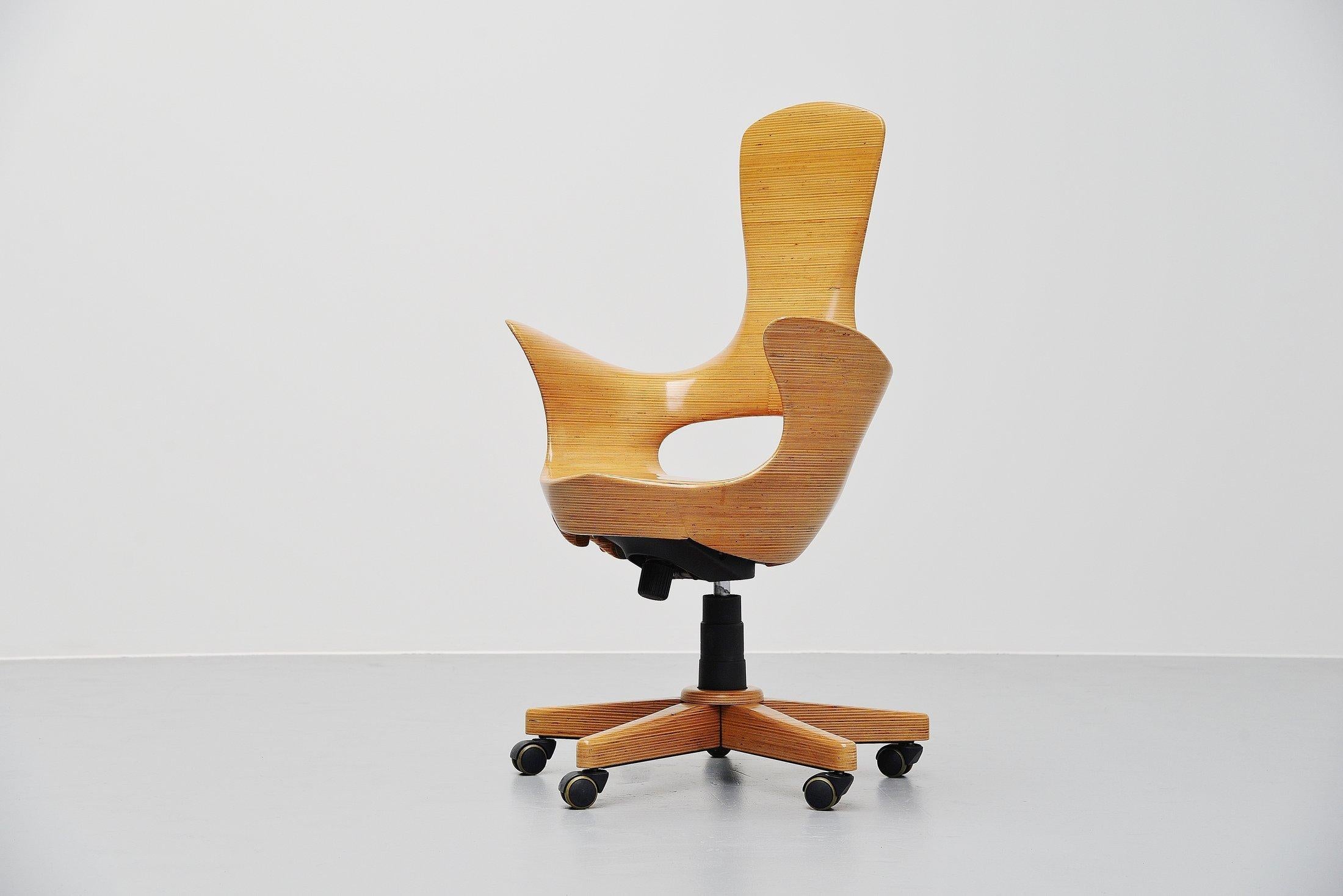 Stunning sculptural desk chair designed by David Delthony and manufactured in his own studio in Berlin, Germany 1995. David Delthony made sculptural furniture which was possible inspired by the works from Wendell Castle. David Delthony is an