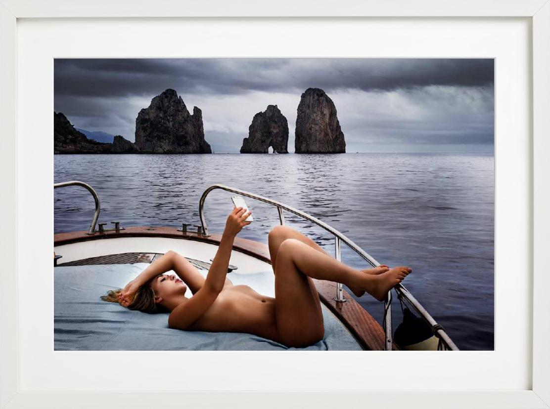 Capri Selfie - nude on a boat under cloudy sky, fine art photography, 2016 - Contemporary Photograph by David Drebin
