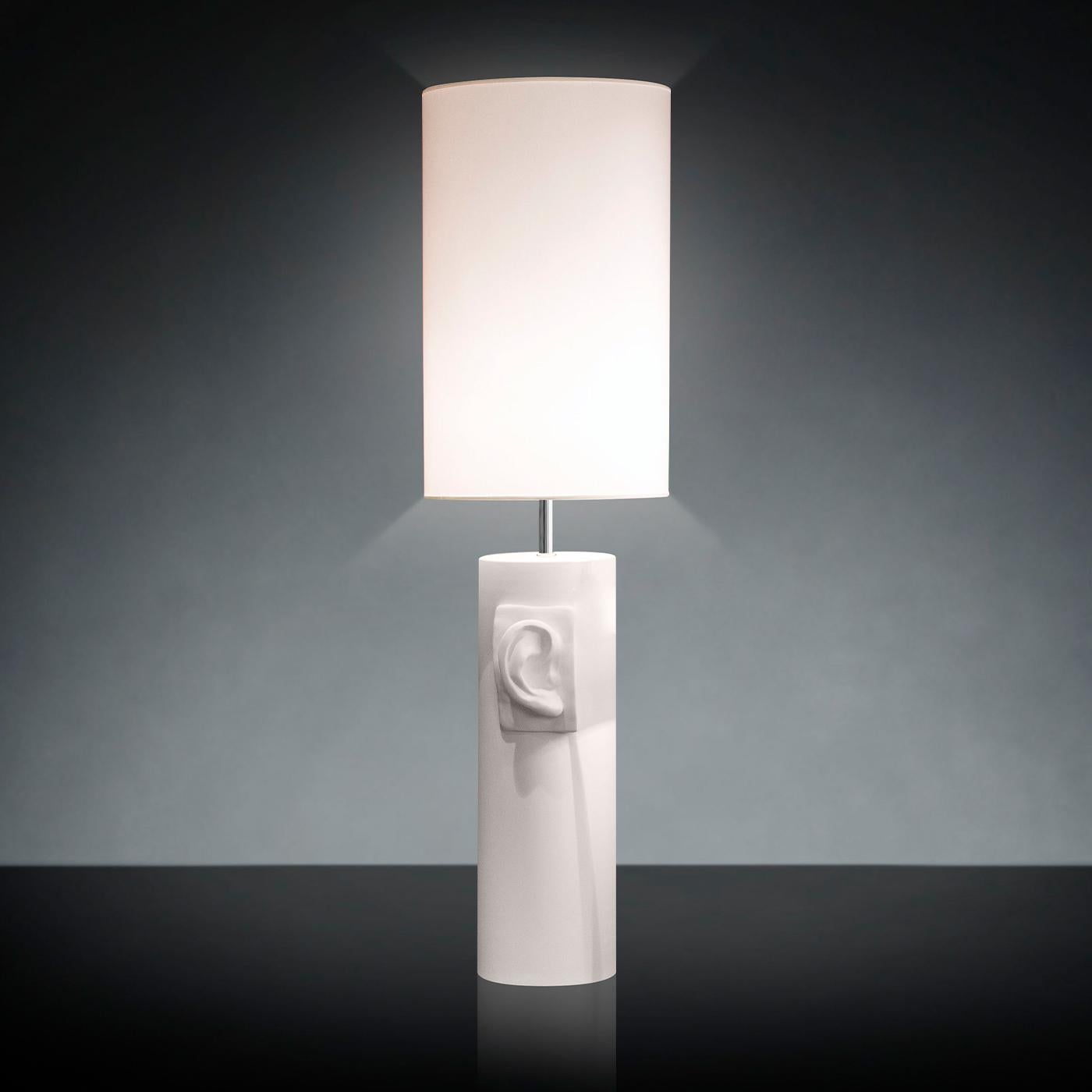 Marked by a sleek cylindrical silhouette, this white ceramic lamp belongs to a series of vases and floor/table lamps that celebrate Italian art and handicraft. A piece of strong visual impact, this modern design features a tall lampshade housing a