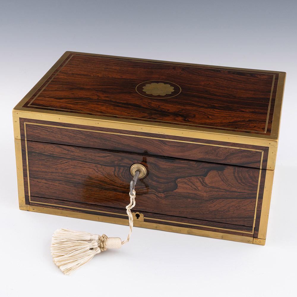 Heading : David Edwards Georgian antique jewellery box c1830

Date : c1830

Period : George IV / William IV

Origin : London, England

Decoration : Brass bound box with central lion rampant above a coronet within a brass cartouche. Inteiror with