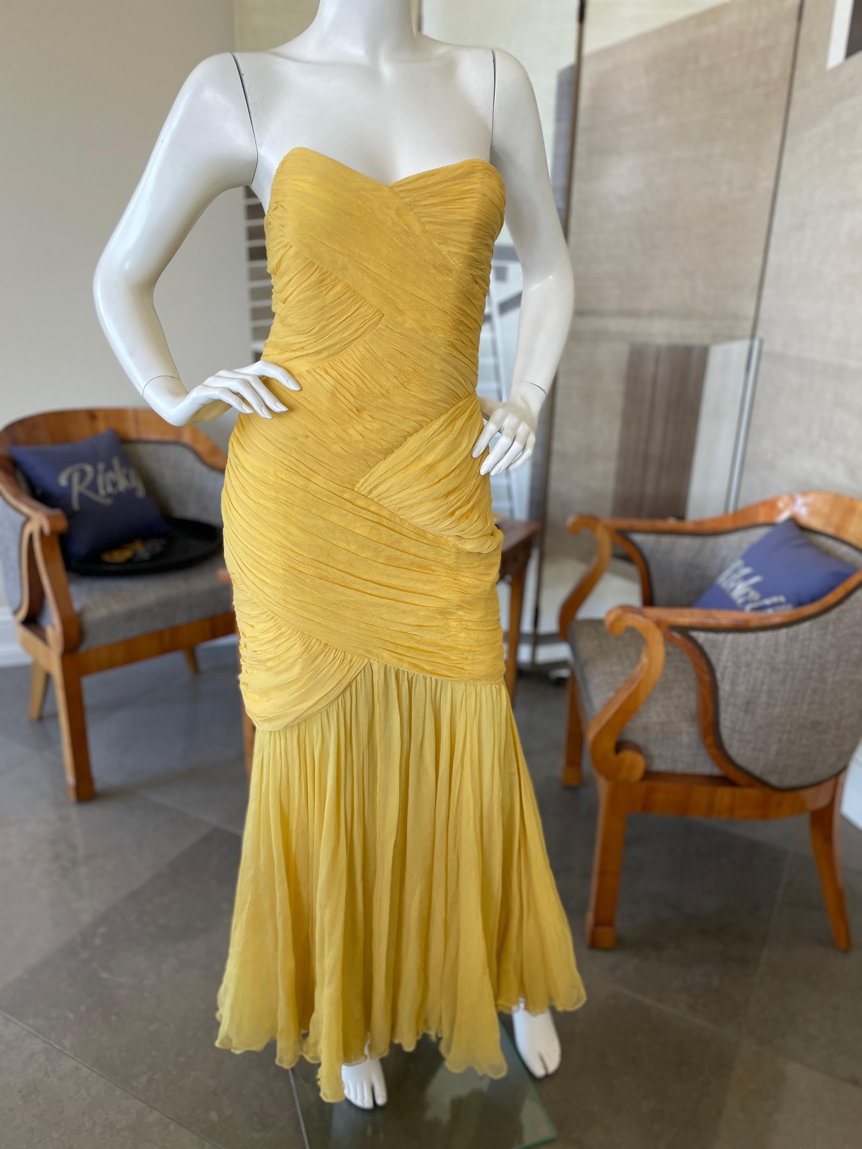 David Fielden London Yellow Silk Chiffon Strapless Dress with Matching Shawl.
David Fielden was one of the favorite London designer of Princess Diana.
Size 8 from the 80's it's more like a US 4 today
 Bust 34