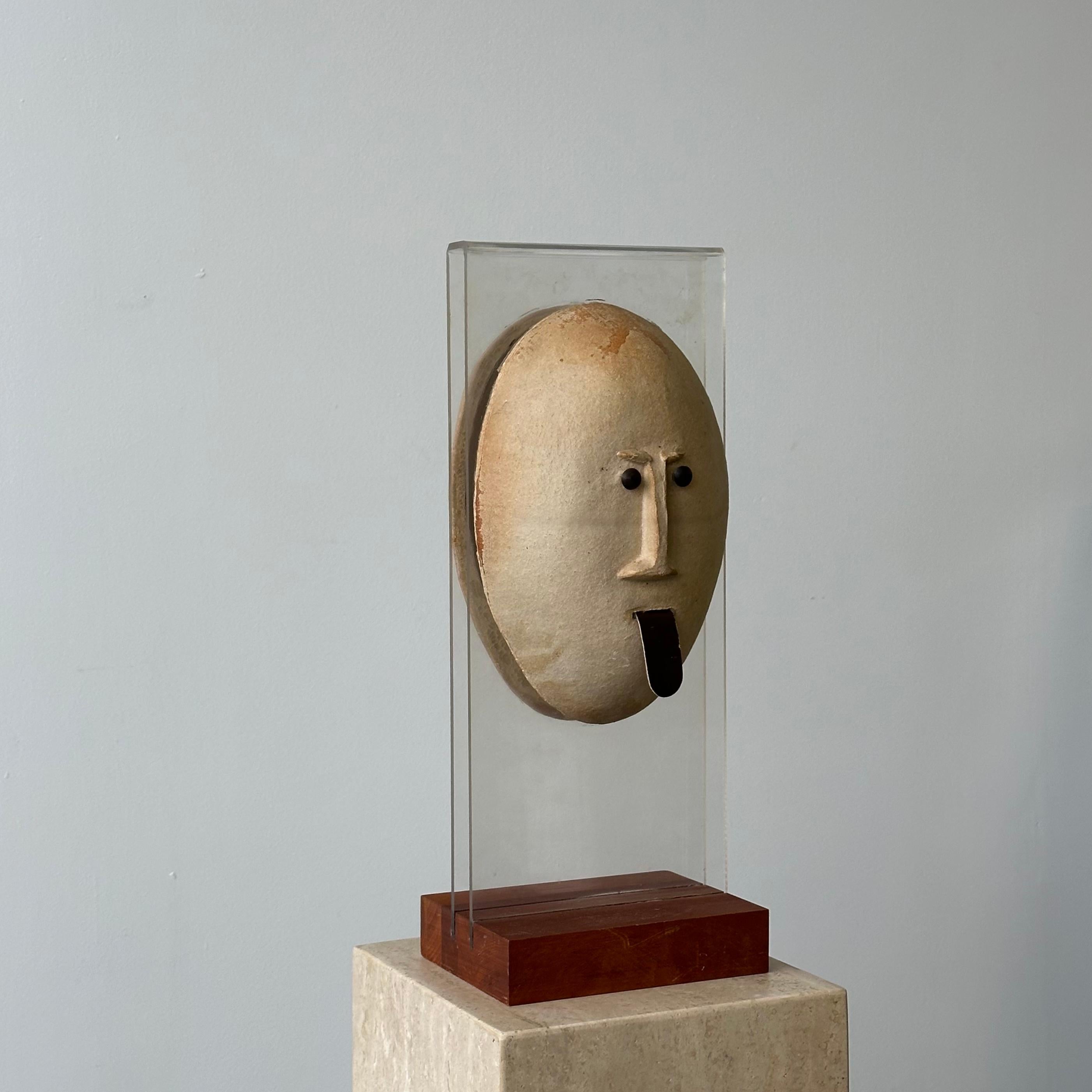 This hand-built ceramic sculpture is set on a lucite frame that’s attached to a solid cherry base. The piece is signed on the reverse side by Gil who is the founder of Bennington Pottery