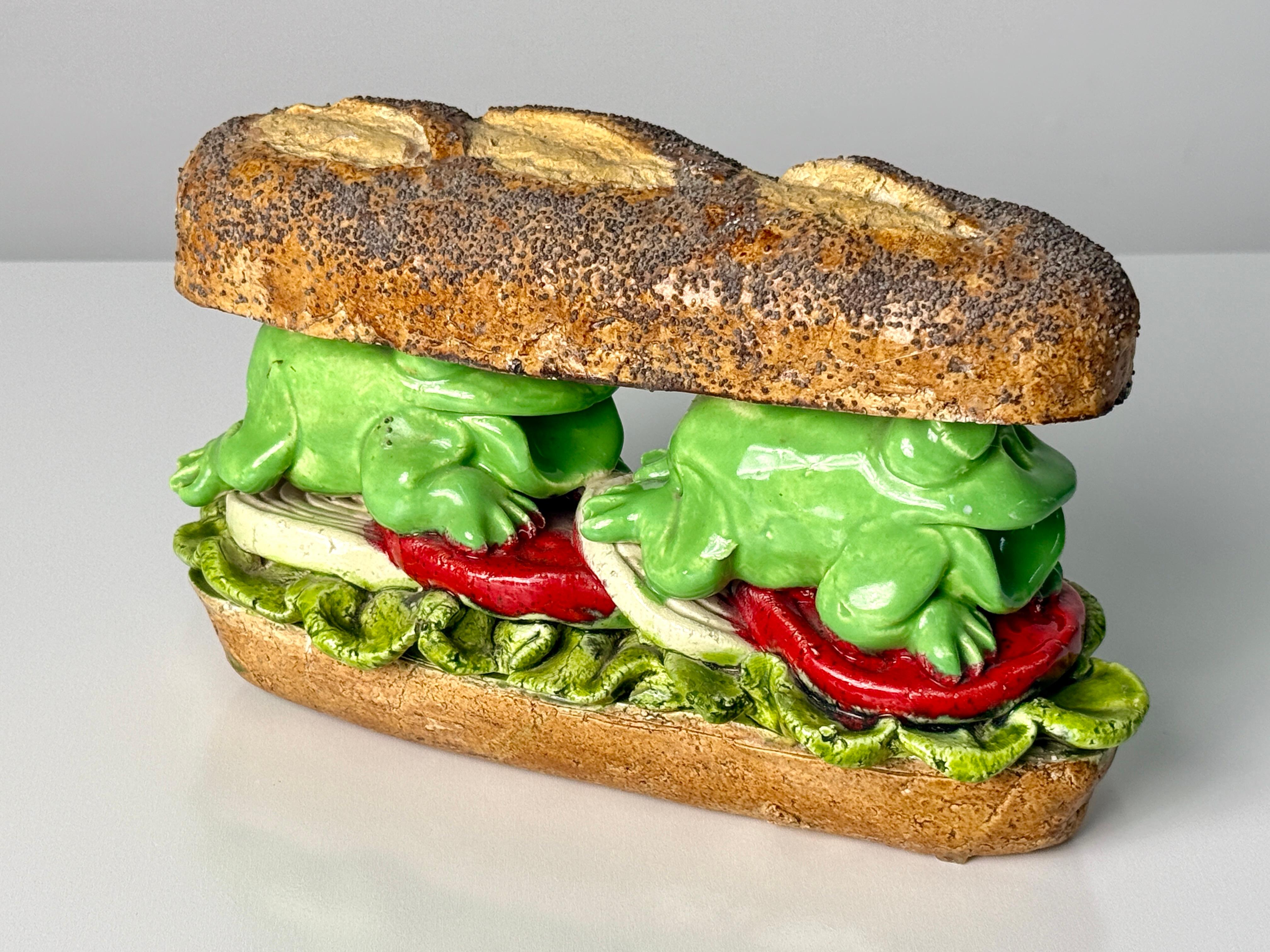 David Gilhooly (1943-2013)
Frog Sandwich

1983
Glazed Earthenware
9.5 x 4 x 6 in

David Gilhooly (1943–2013) was an American ceramic sculptor and key figure in the Funk Art movement of the 1960s. Born in California, and student of Robert Arneson at