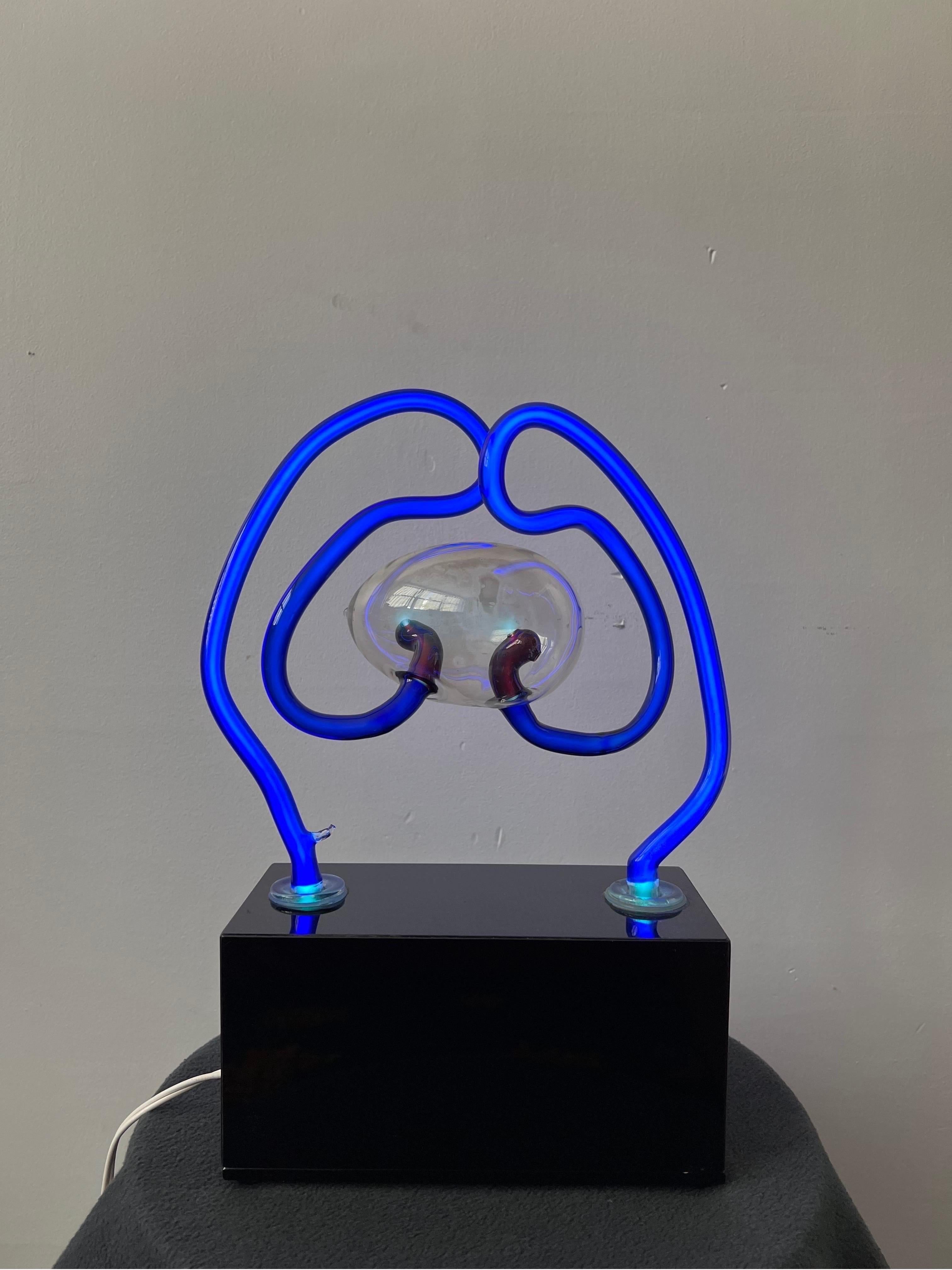 Artisan blown glass neon lamp sculpture on black acrylic base by David Grant Maul, 1983. Singed and dated.
