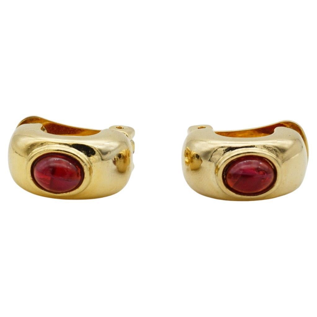 David Grau Vintage 1980s Unisex Oval Ruby Red Cabochon Crystal Hoop Dome Clip Earrings, Gold Plated

Very excellent condition and very new. Very high quality. 100% Genuine.

Material: Gold plated metal, Rhinestone.

Size: 2.0*1.0 cm.

Weight: 9.0