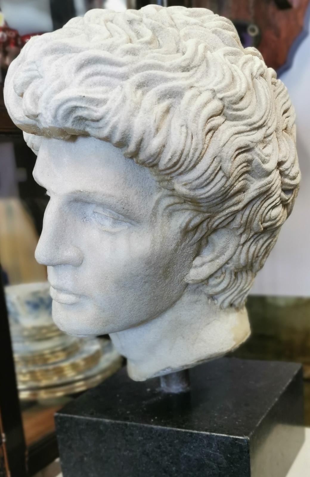 David, Greco-Roman style faux marble head, on a granite base, 
by Australian sculpture Martin Russell, unsigned, 
weighs 29kg 
Measures: 21 x 21 x 47cm high, base measures 21 x 10cm.
