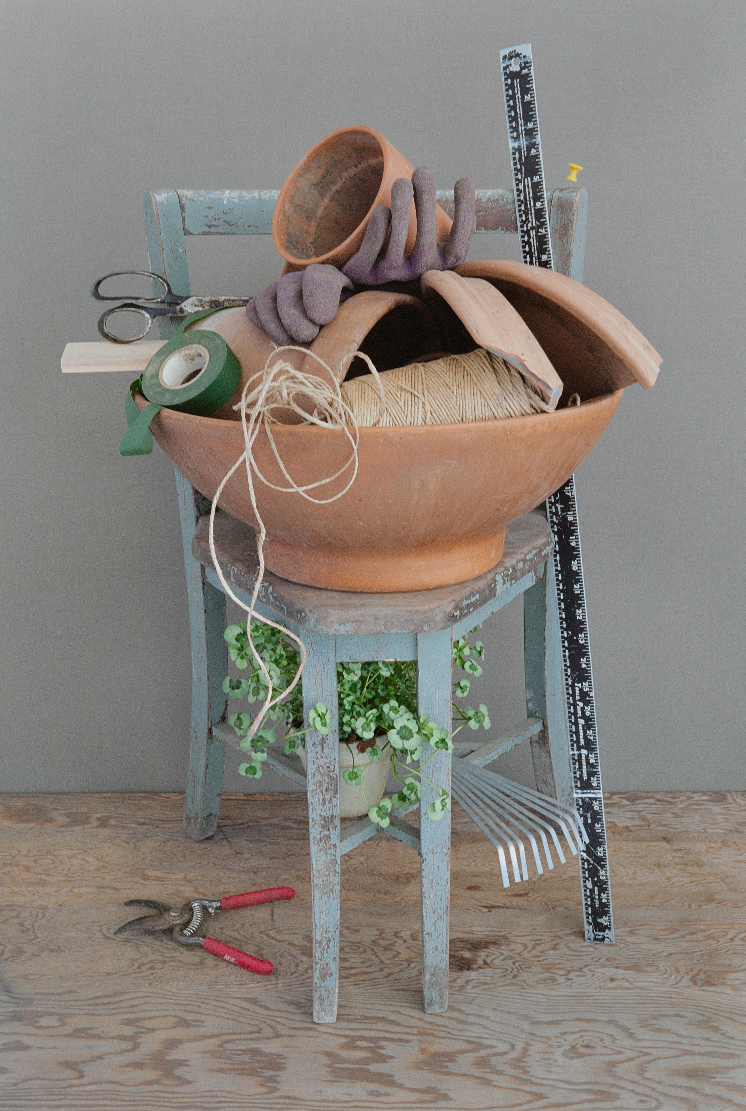 Contemporary still life photograph of domestic objects and gardening tools by David Halliday 
"Garden Chair", ed. 1 of 7, archival pigment print
29.75 x 20 inches unframed, 34 x 24.5 x 1.5 inches framed
Custom Poplar wood shadowbox frame with
