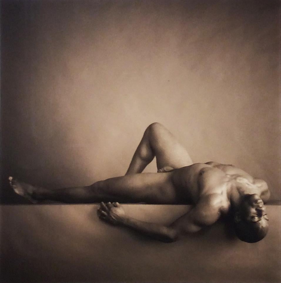 David Halliday Nude Photograph - Male Nude on Back with Knee Up (Sepia Toned Figurative Photograph in Wood Frame)