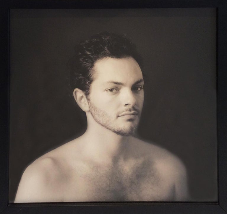 Contemporary sepia toned photograph, portrait of a young man 
Sepia toned silver gelatin print, edition of 25
16 x 16 inches in wood frame with wire backing 

This contemporary portrait photograph was taken by David Halliday in 2004. The sepia toned