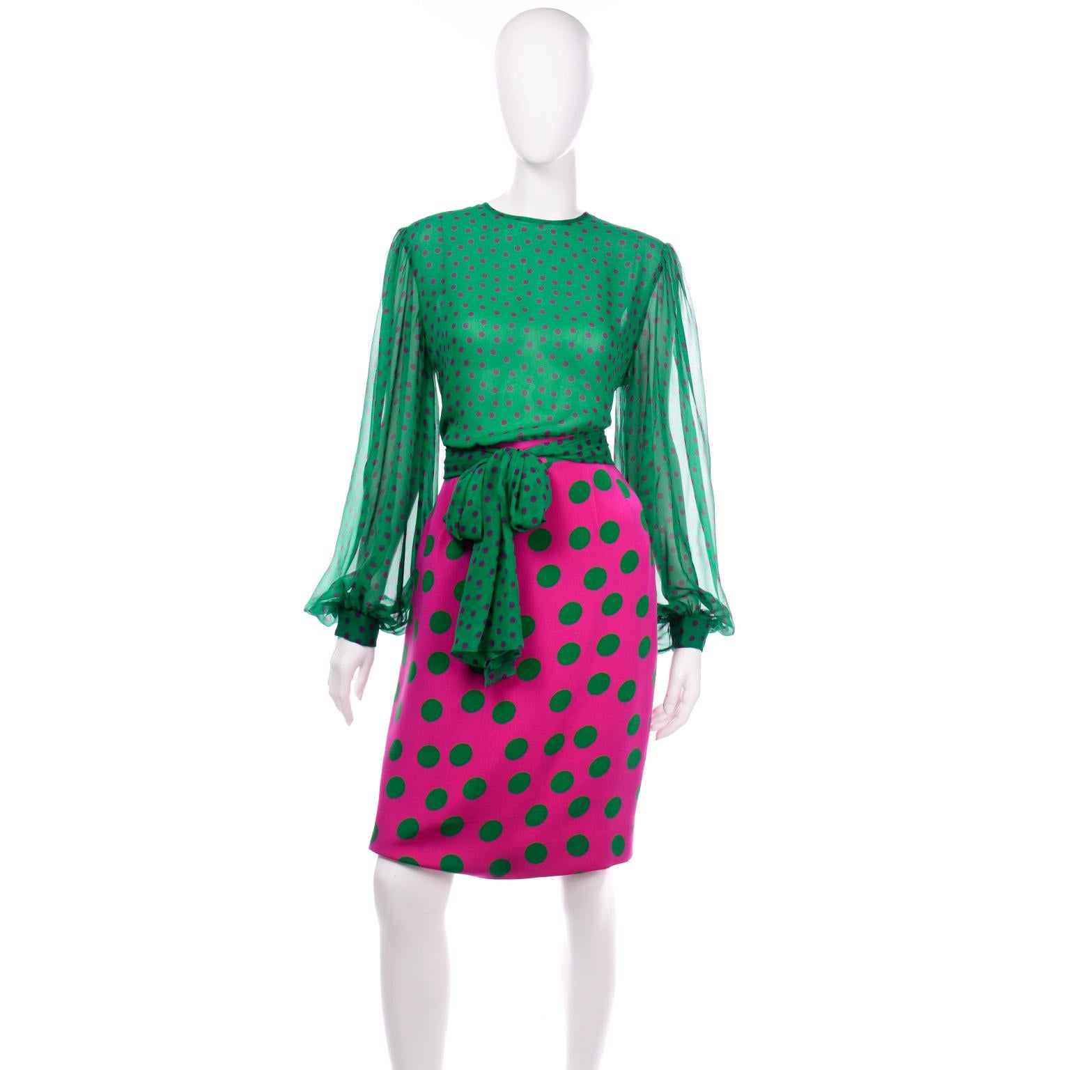 This vintage late 1980's David Hayes fuschia and green polka dot skirt suit originally sold at Saks Fifth Avenue for $1670. The base color of the fully lined jacket and skirt is fuschia pink and the polka dots are green. The beautiful silk blouse