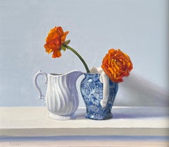 Ranuncolo arancione in vaso blu